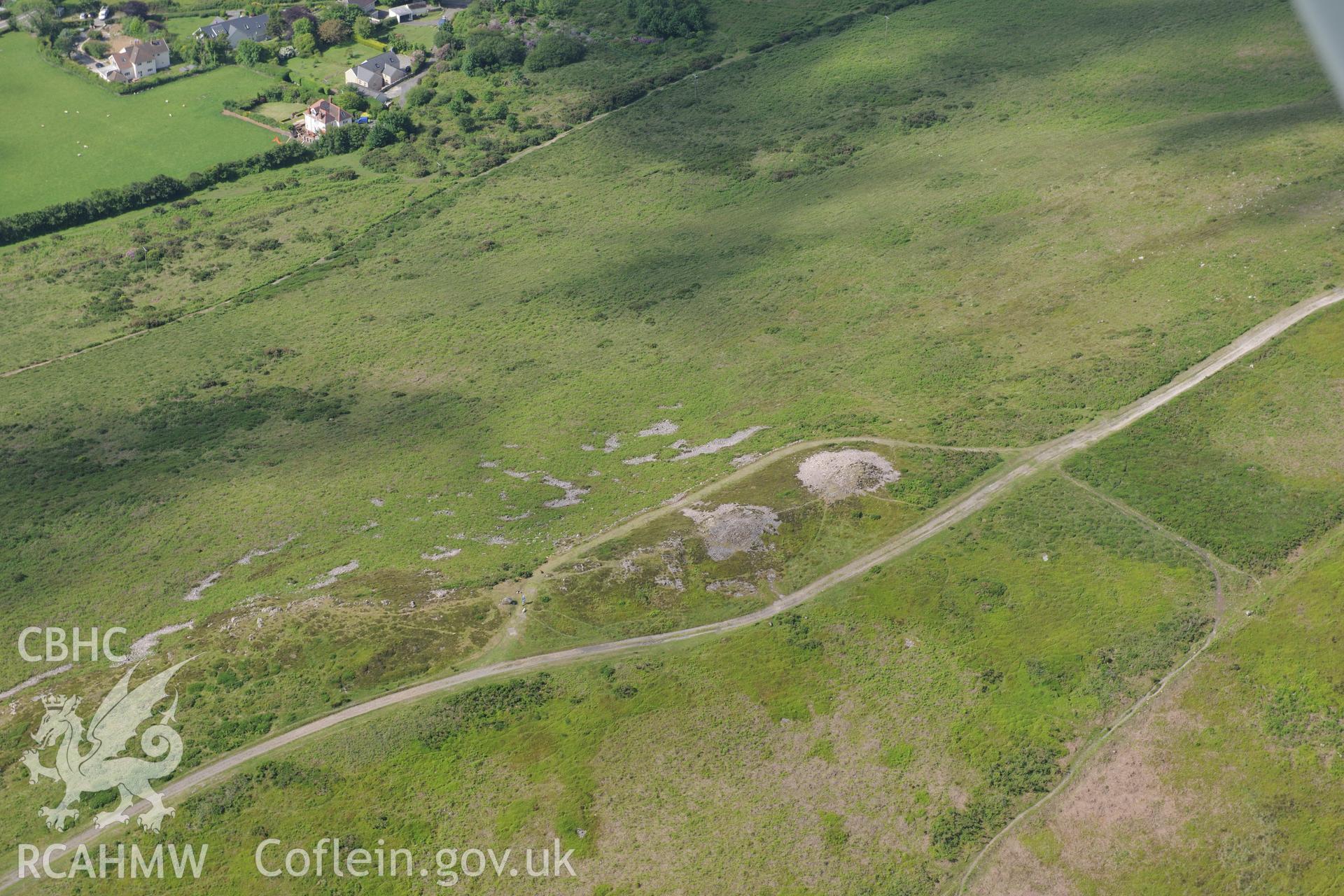 Cairns  and Beacon II on Cefn Bryn. Oblique aerial photograph taken during the Royal Commission's programme of archaeological aerial reconnaissance by Toby Driver on 19th June 2015.