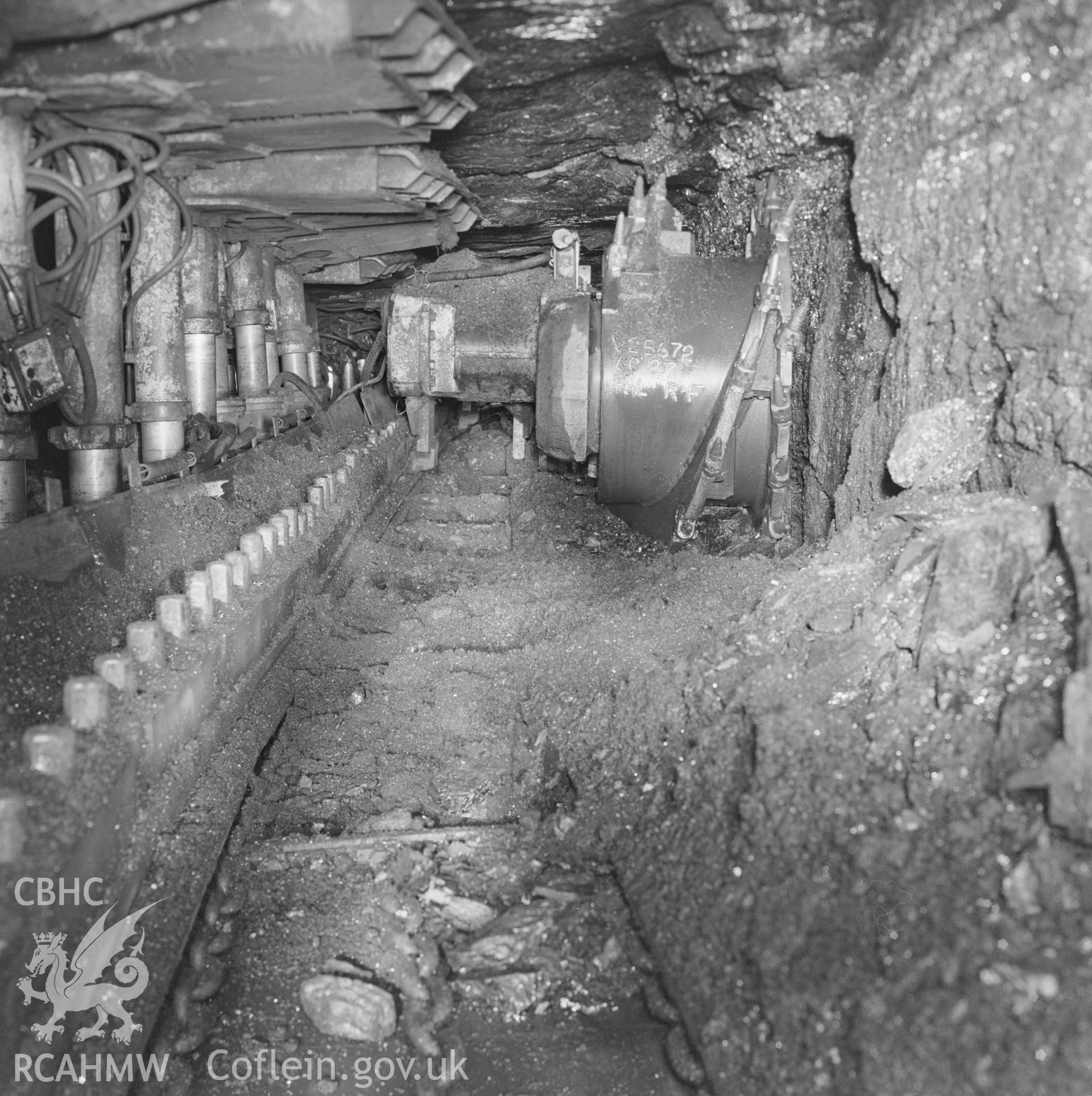 Digital copy of an acetate negative showing shearer on coal face at Blaenant Colliery, from the John Cornwell Collection.
