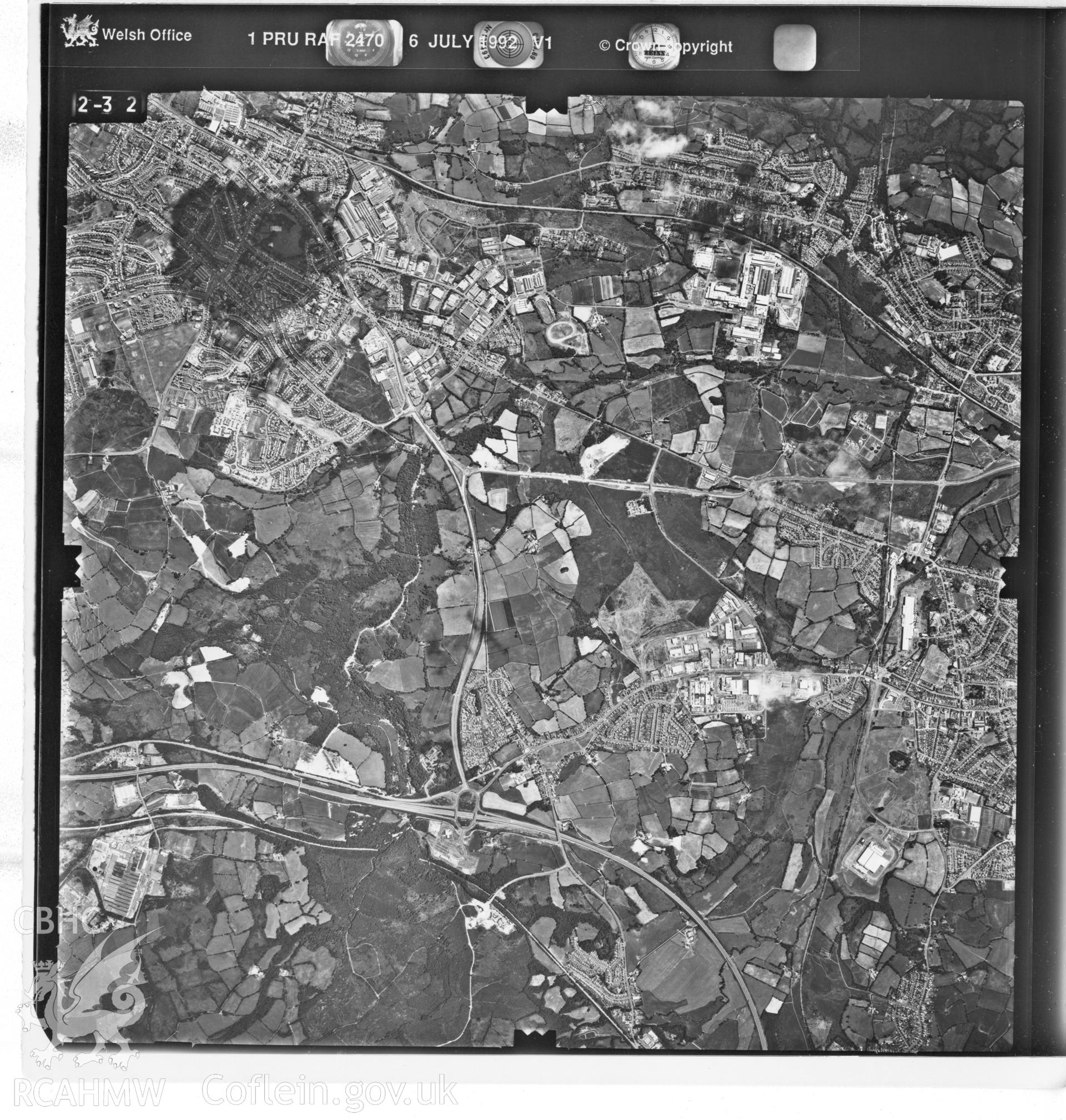 Black and white aerial photograph taken on 6th July 1992. Part of material used in a Setting Impact Assessment of Land off Phoenix Way, Garngoch Business Village, Swansea, carried out by Archaeology Wales, 2018. Project number P2631.