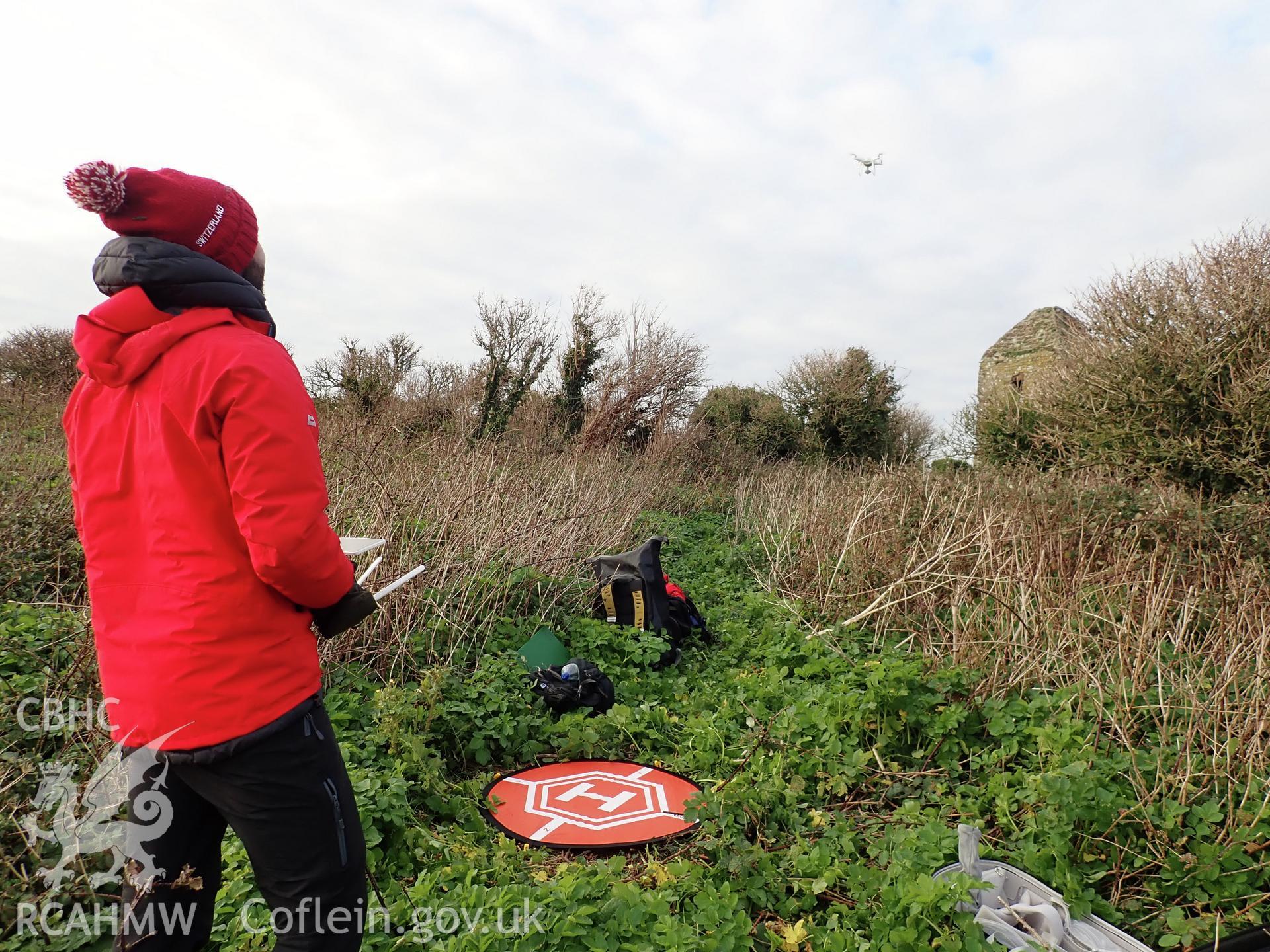 Drone/UAV survey in progress by Dan Hunt on the church on Puffin Island or Ynys Seiriol, 26 November 2018 for the CHERISH Project. ? Crown: CHERISH PROJECT 2018. Produced with EU funds through the Ireland Wales Co-operation Programme 2014-2020. All material made freely available through the Open Government Licence.