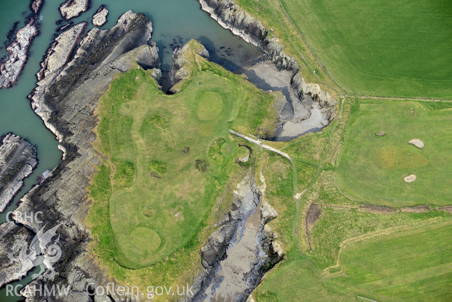 Royal Commission aerial photograph of Gwbert promontory fort taken on 27th March 2017. Baseline aerial reconnaissance survey for the CHERISH Project. ? Crown: CHERISH PROJECT 2017. Produced with EU funds through the Ireland Wales Co-operation Programme 2014-2020. All material made freely available through the Open Government Licence.