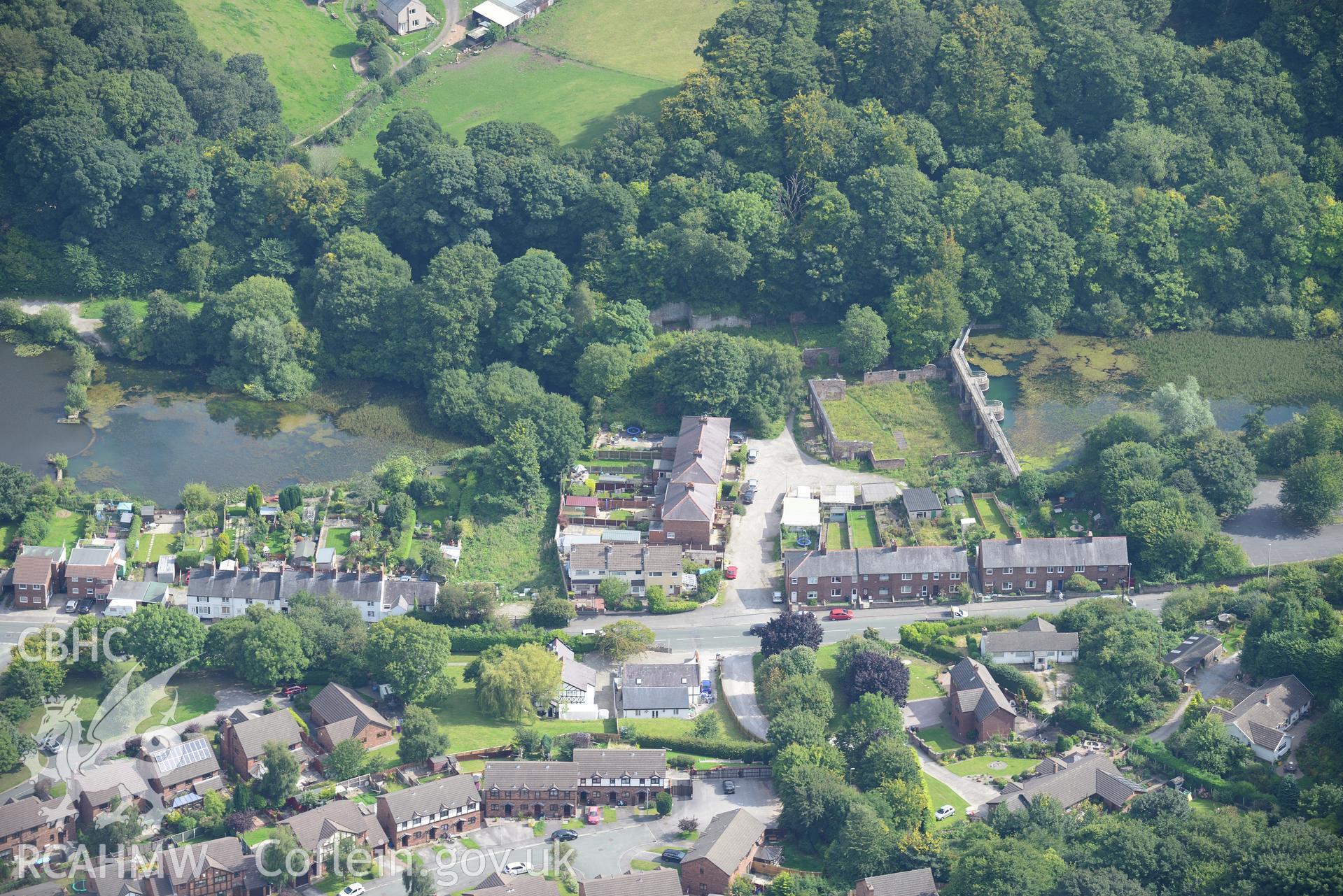 Meadow Mills, Greenfield Valley Heritage Park, Holywell. Oblique aerial photograph taken during the Royal Commission's programme of archaeological aerial reconnaissance by Toby Driver on 11th September 2015.