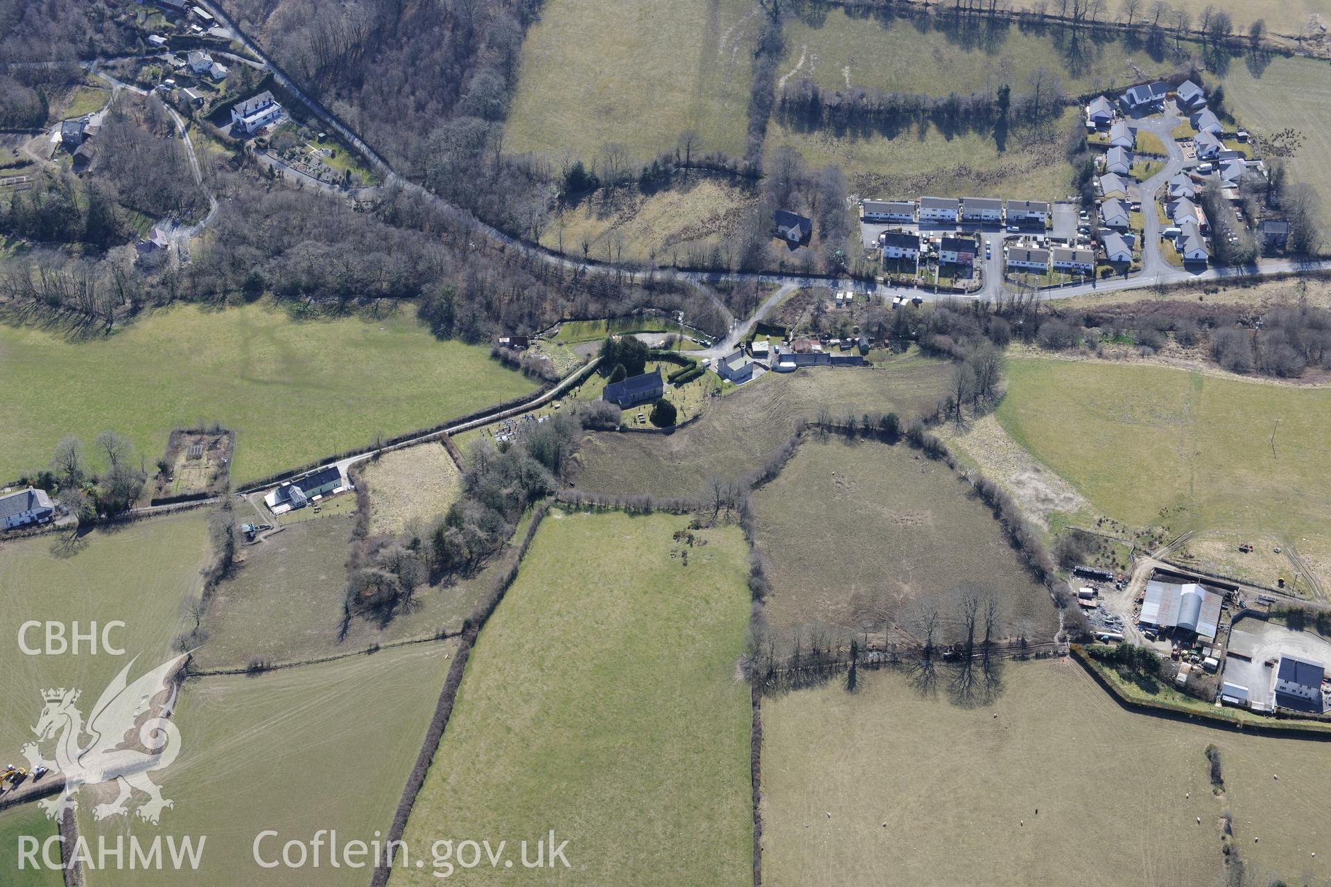 St Sulien's church, in the village of Silian, north of Lampeter. Oblique aerial photograph taken during the Royal Commission?s programme of archaeological aerial reconnaissance by Toby Driver on 2nd April 2015.