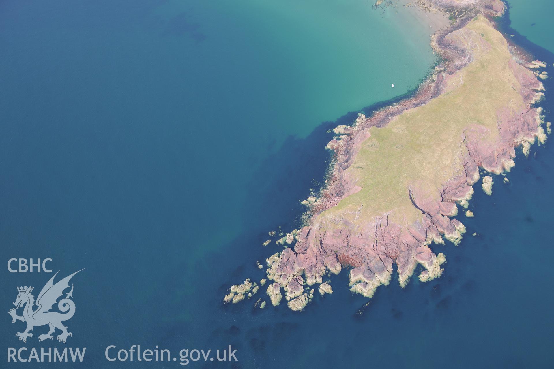 Gateholm Island and the wreck of Albion on Albion Sands, west of Milford Haven. Oblique aerial photograph taken during the Royal Commission?s programme of archaeological aerial reconnaissance by Toby Driver on 16th July 2013.