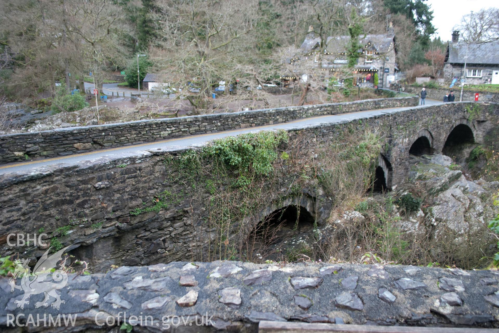 General view of Pont y Pair showing the side elevation with arches, reveals and voussoirs. Digital photograph taken for Archaeological Watching Brief at Pont y Pair, Betws y Coed, 2019. Gwynedd Archaeological Trust Project ref G2587.