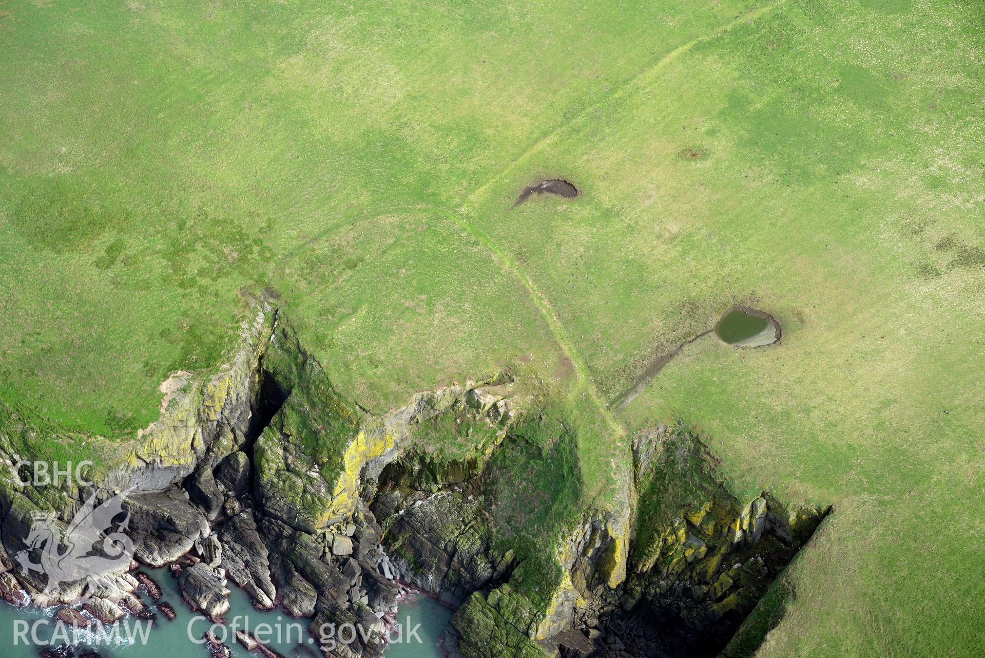 Aerial photography of Cardigan Island promontory enclosure taken on 27th March 2017. Baseline aerial reconnaissance survey for the CHERISH Project. ? Crown: CHERISH PROJECT 2017. Produced with EU funds through the Ireland Wales Co-operation Programme 2014-2020. All material made freely available through the Open Government Licence.