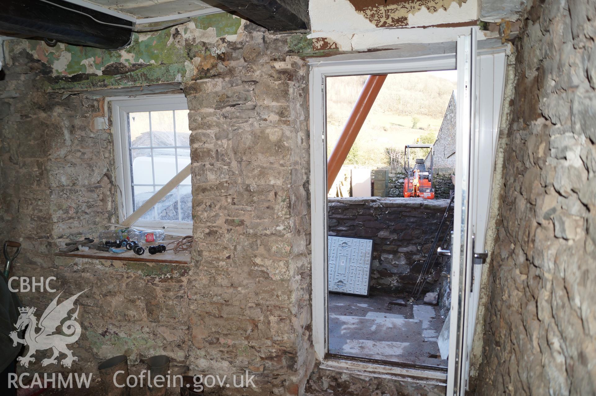 Internal view 'looking east southeast showing front room of annex. Note that the blocking-in below the window alhtough this is not visible externally' on Gwrlodau Farm, Llanbedr. Photograph & description by Jenny Hall & Paul Sambrook of Trysor, 9/2/2018.