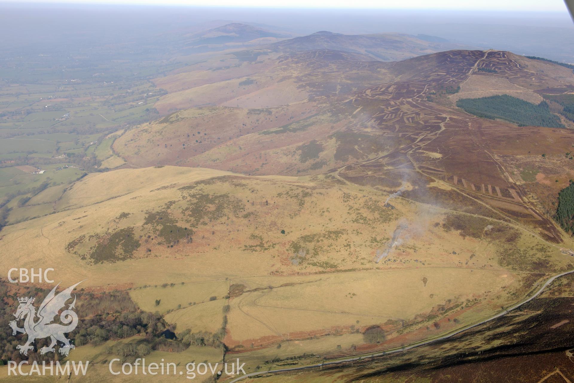 Jubilee Tower, with repair works in progress, on Moel Famau, Llangynhafal, between Mold and Ruthin. Oblique aerial photograph taken during the Royal Commission?s programme of archaeological aerial reconnaissance by Toby Driver on 28th February 2013.