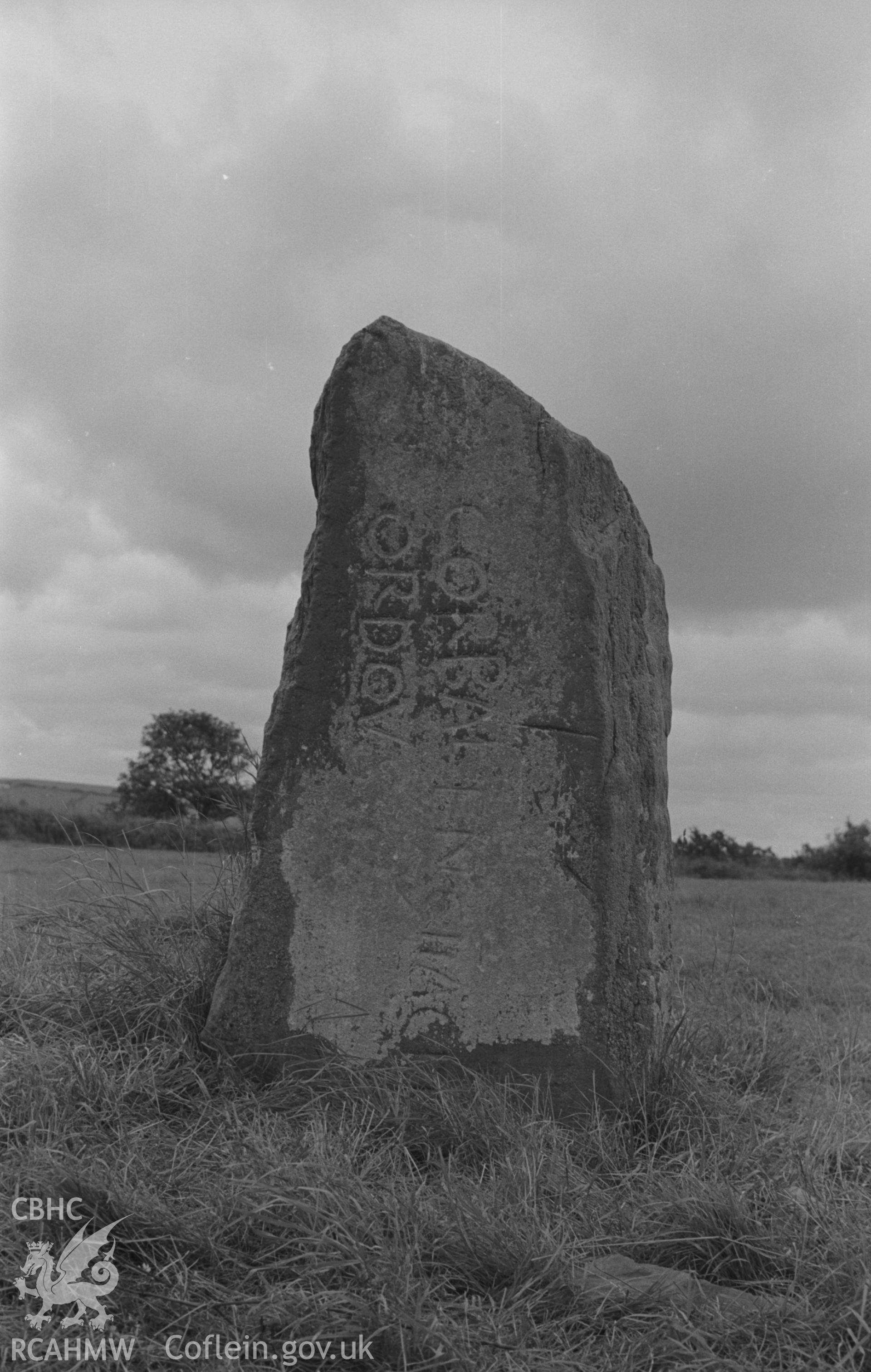 Digital copy of a black and white negative showing the Corbalengi stone. Photographed in August 1963 by Arthur O. Chater from Grid Reference SN 2891 5137, looking south west.