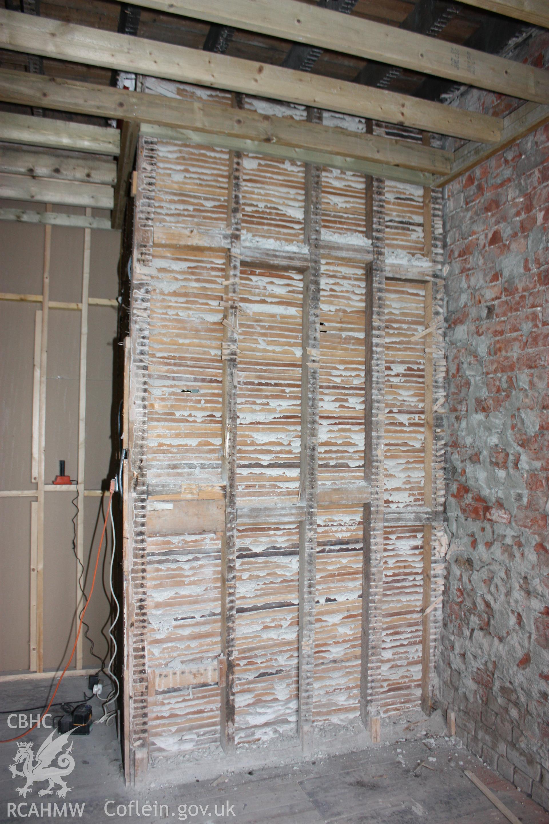 Colour photograph showing interior lathe and plaster walls of stairwell at the Old Auction Rooms/ Liberal Club in Aberystwyth. Photographic survey conducted by Geoff Ward on 9th June 2010 during repair work prior to conversion into flats.