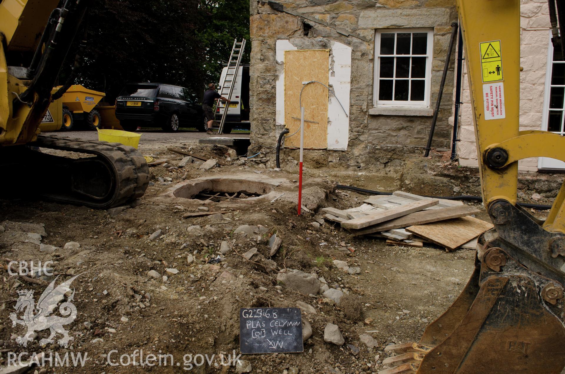 'Location shot of the well, view from the north north east.' Photographed by Gwynedd Archaeological Trust as part of archaeological mitigation report for well at Plas Celynin, Henryd, Conwy, on 1st August 2018. Project no. G2568.