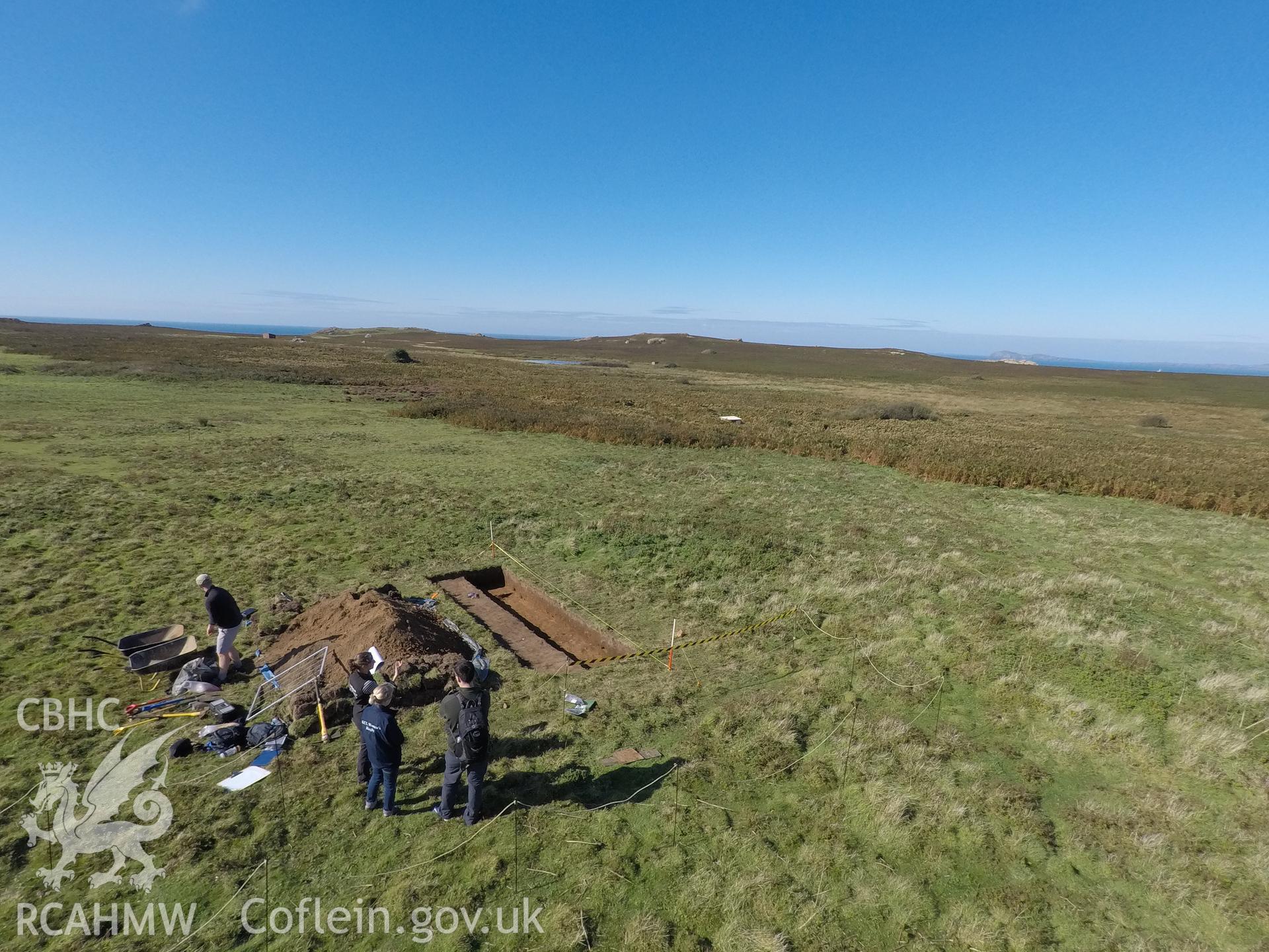 Investigator's photography showing the evaluation excavation of a geophysical anomaly in Well Meadow, Skomer Island, between 25-27th Sept 2018 as part of the Skomer Island Project. High view of trench from east.