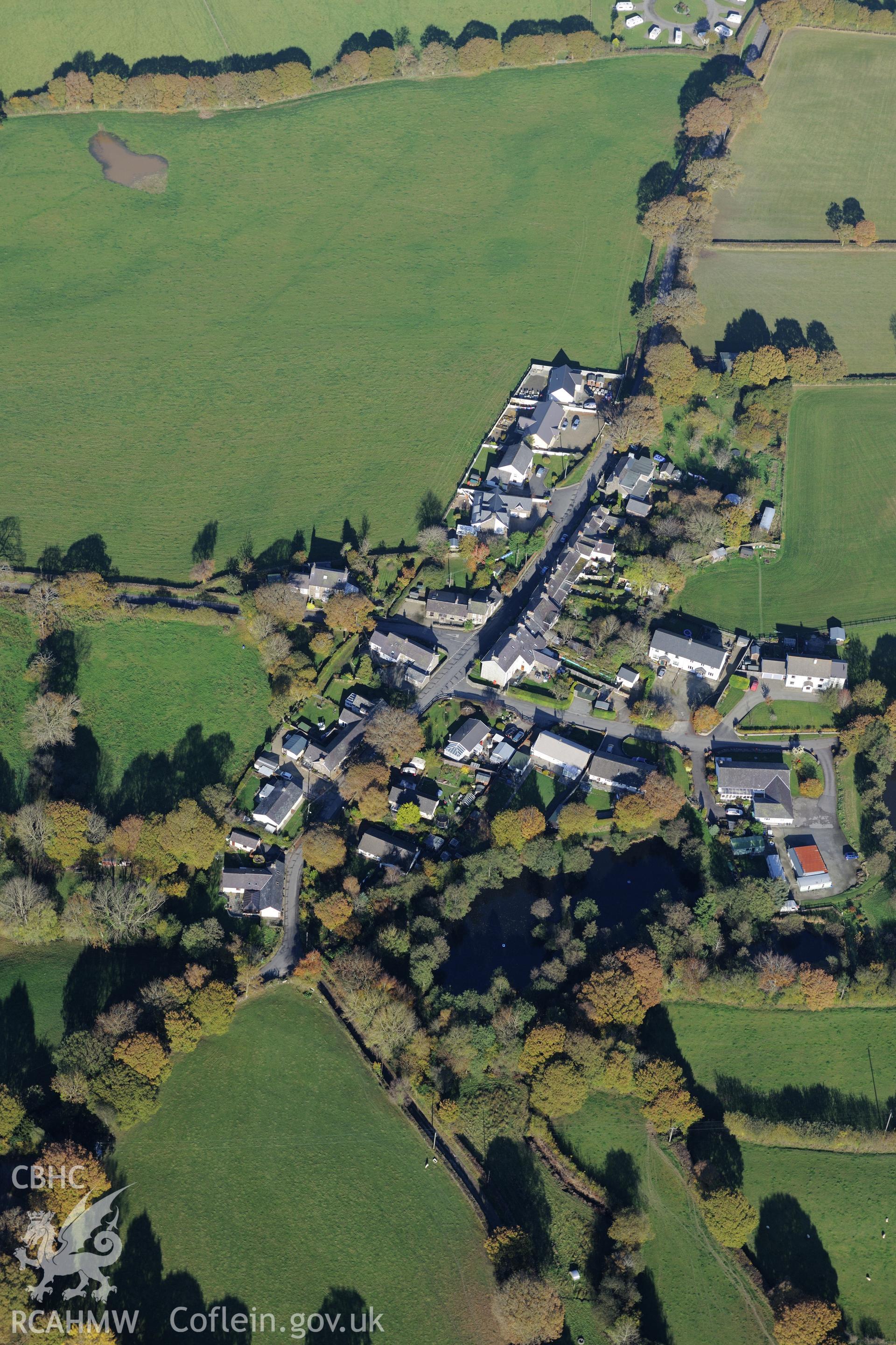 The village of Derwen Gam (Oakford). Oblique aerial photograph taken during the Royal Commission's programme of archaeological aerial reconnaissance by Toby Driver on 2nd November 2015.