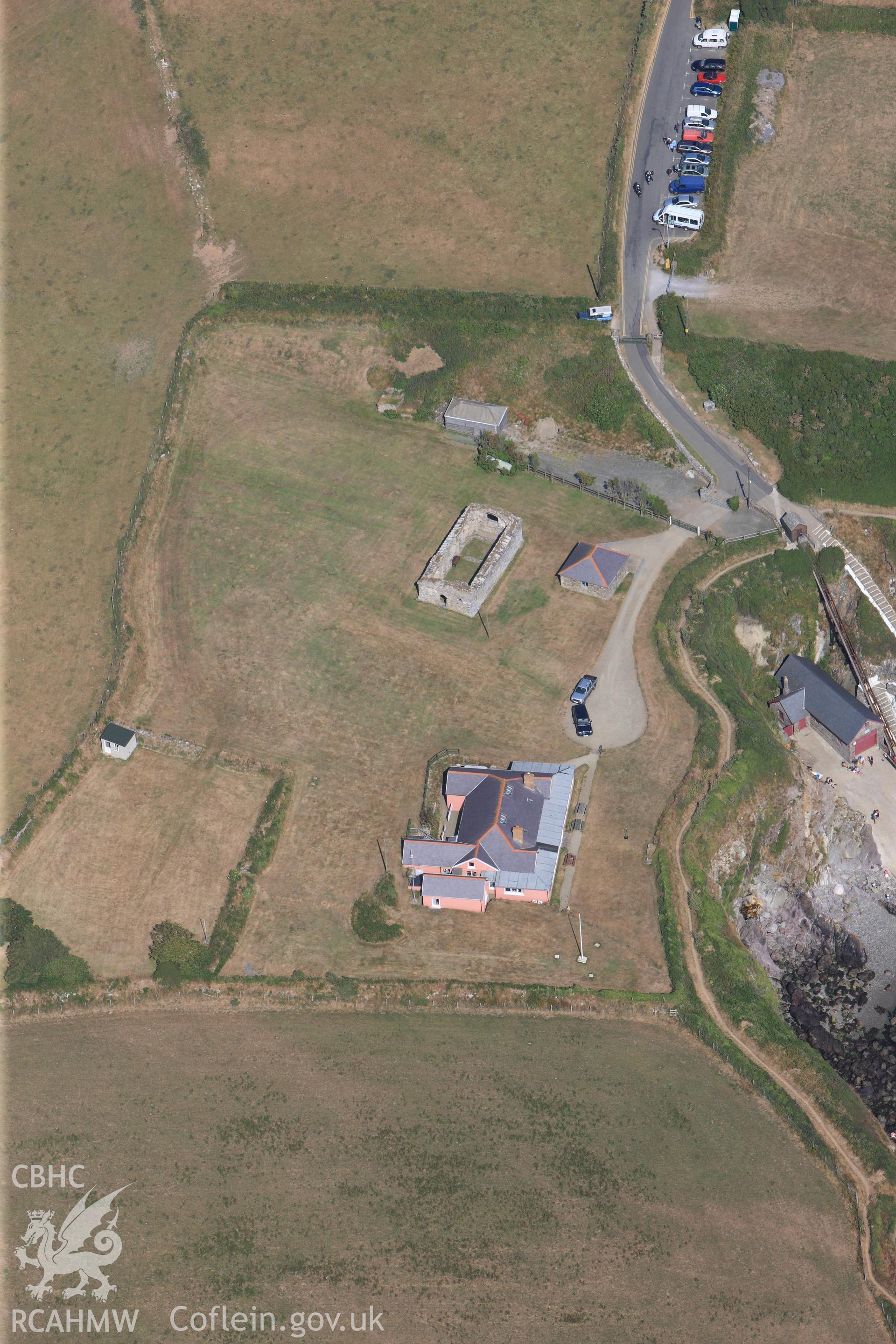 St Justinian's bungalow and St Justinian's chapel, west of St Davids. Oblique aerial photograph taken during the Royal Commission?s programme of archaeological aerial reconnaissance by Toby Driver on 16th July 2013.