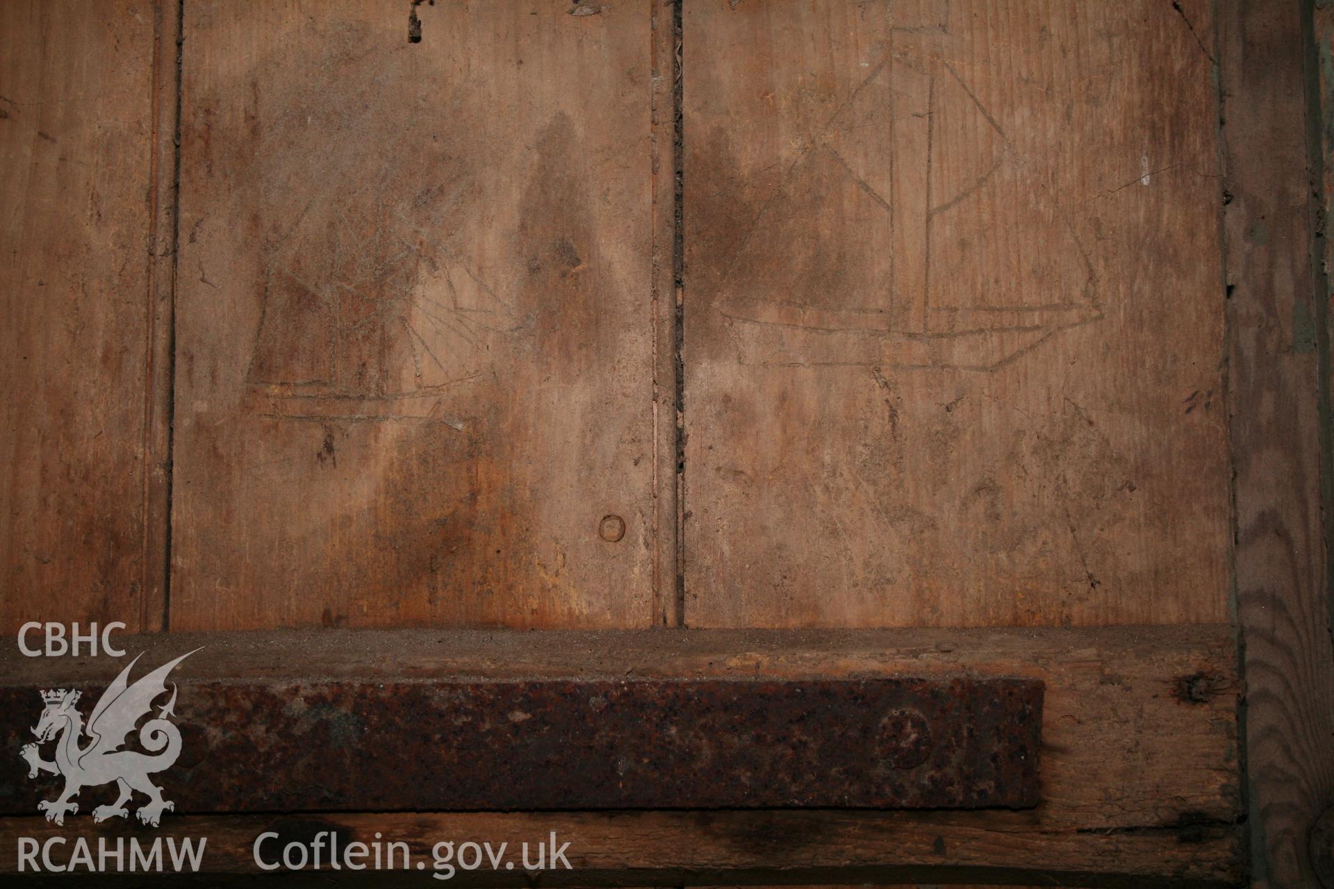 Interior view of wooden door with boat 'graffiti'. Photographic survey of the threshing house, straw house, mixing house and root house at Tan-y-Graig Farm, Llanfarian, conducted by Geoff Ward and John Wiles, 11th December 2006.