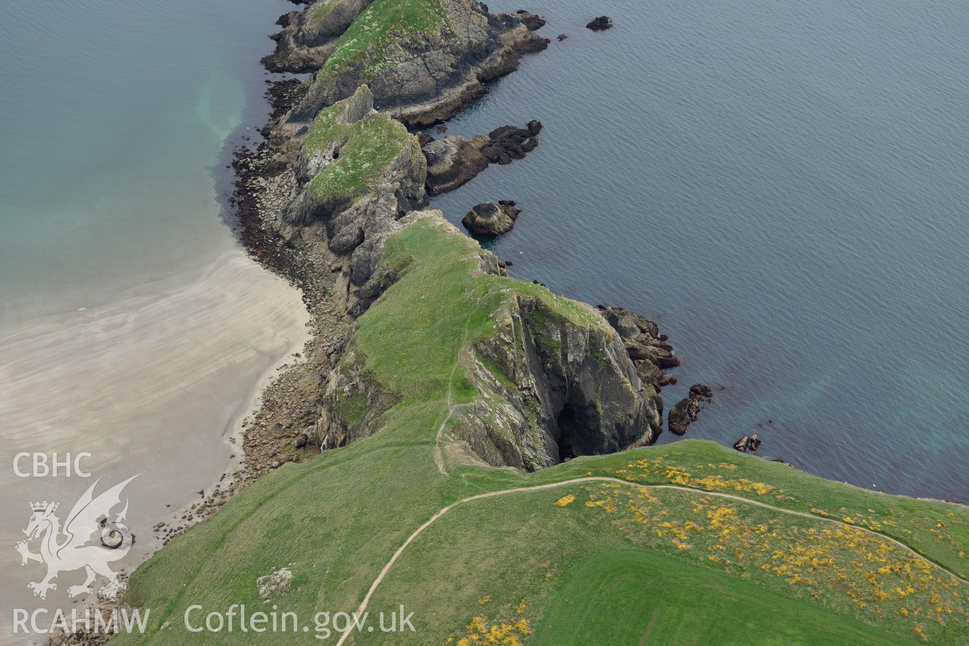 Dinas Fach promontory fort at low tide. Baseline aerial reconnaissance survey for the CHERISH Project. ? Crown: CHERISH PROJECT 2017. Produced with EU funds through the Ireland Wales Co-operation Programme 2014-2020. All material made freely available through the Open Government Licence.