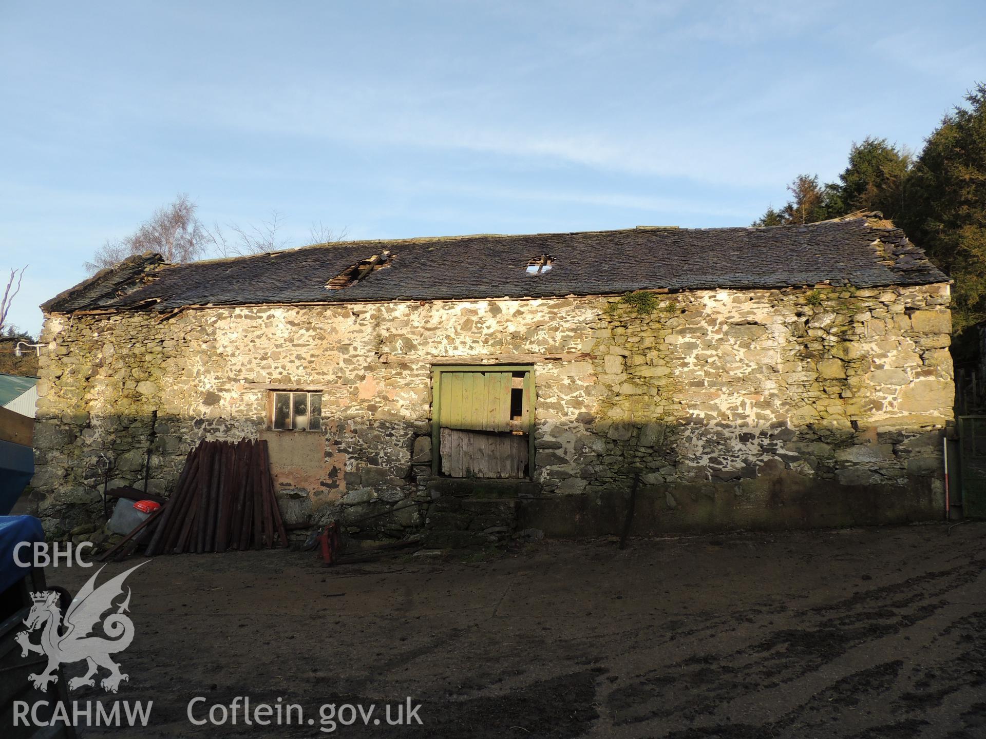 View of front elevation, looking north. Photograph taken as part of archaeological building survey conducted at Bryn Gwylan Threshing Barn, Llangernyw, Conwy, carried out by Archaeology Wales, 2017-2018. Report no. 1640. Project no. 2578.
