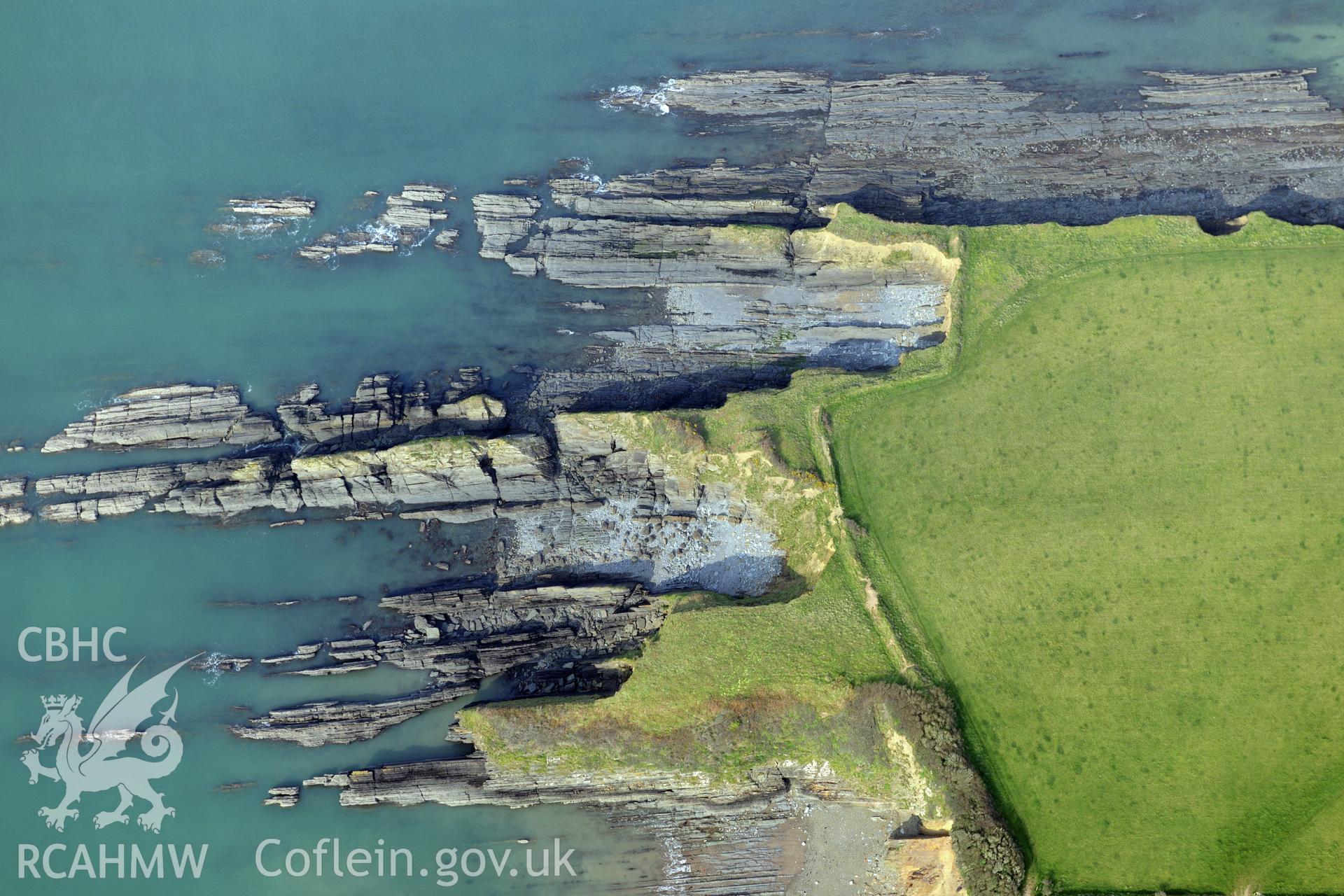 Royal Commission aerial photograph of West Angle Bay promontory fort taken on 27th March 2017. Baseline aerial reconnaissance survey for the CHERISH Project. ? Crown: CHERISH PROJECT 2017. Produced with EU funds through the Ireland Wales Co-operation Programme 2014-2020. All material made freely available through the Open Government Licence.