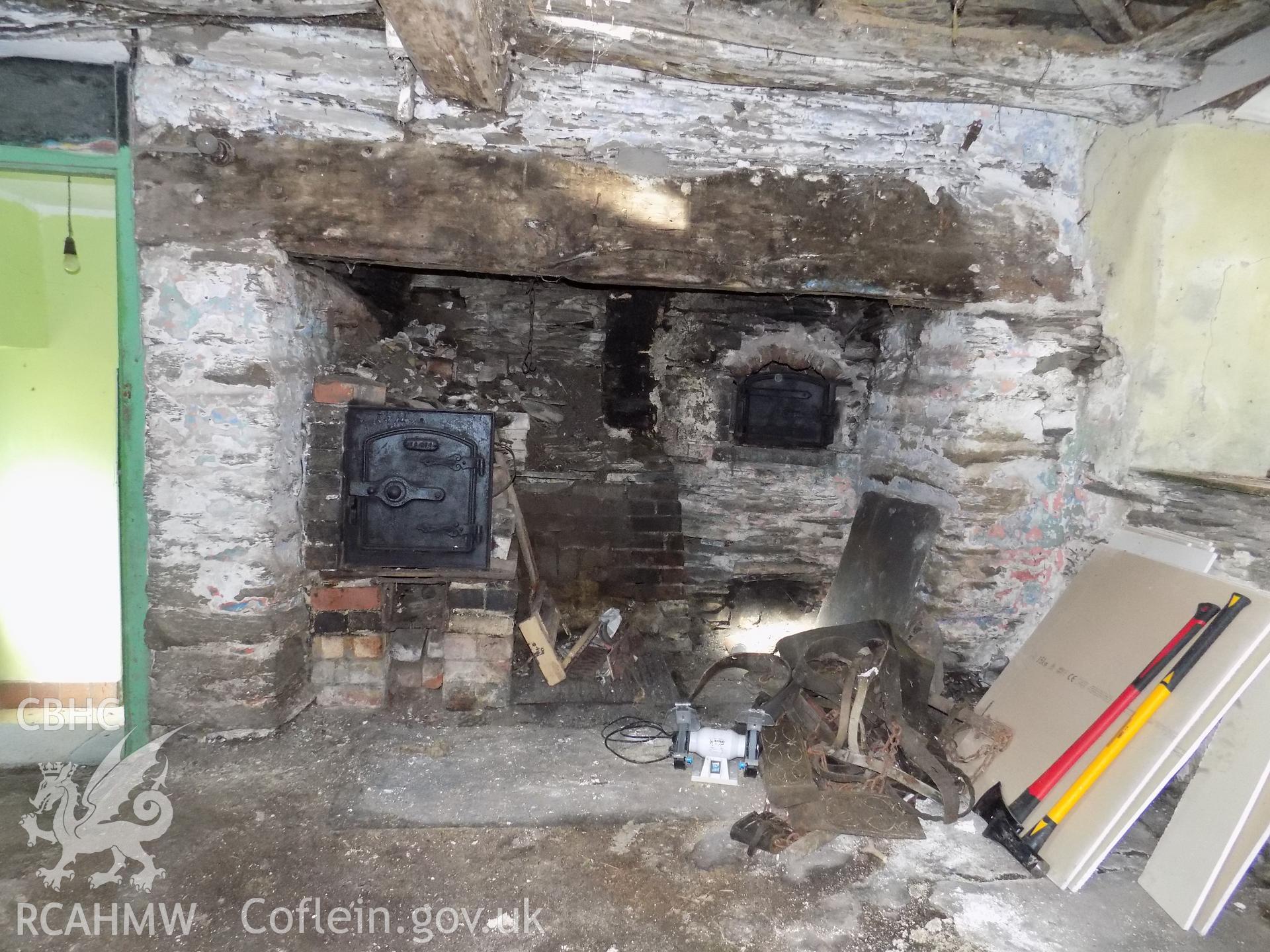 Digital colour photograph showing remains of fireplace in building attached to Tywyll Nodwydd house, Pennal, dated 2019. Photographed by Mr Gary Coulsby to meet a condition attached to a planning application.