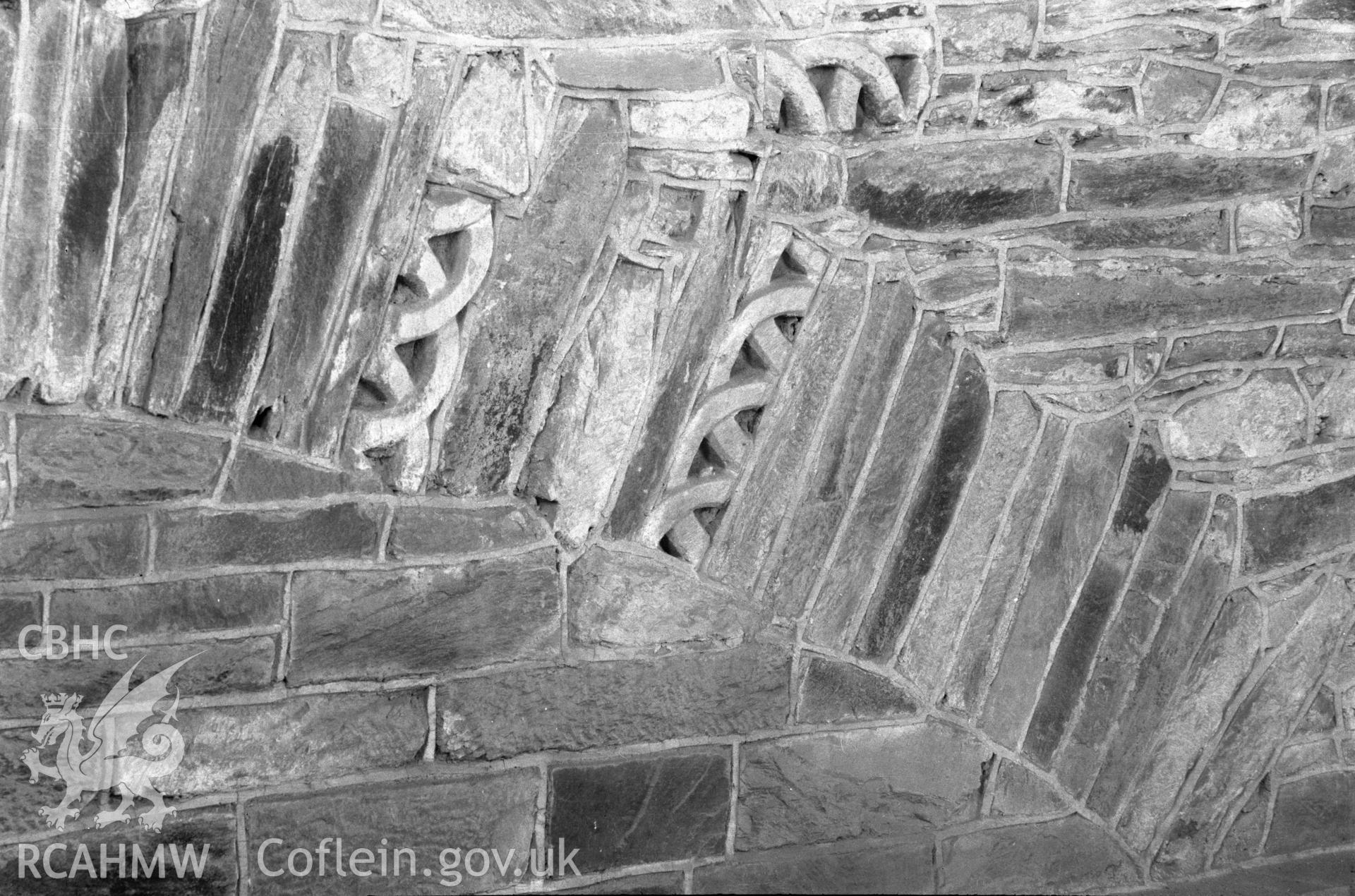 Digital copy of a black and white nitrate negative showing detailed view of stonework arch at St. David's Cathedral, taken by E.W. Lovegrove, July 1936.