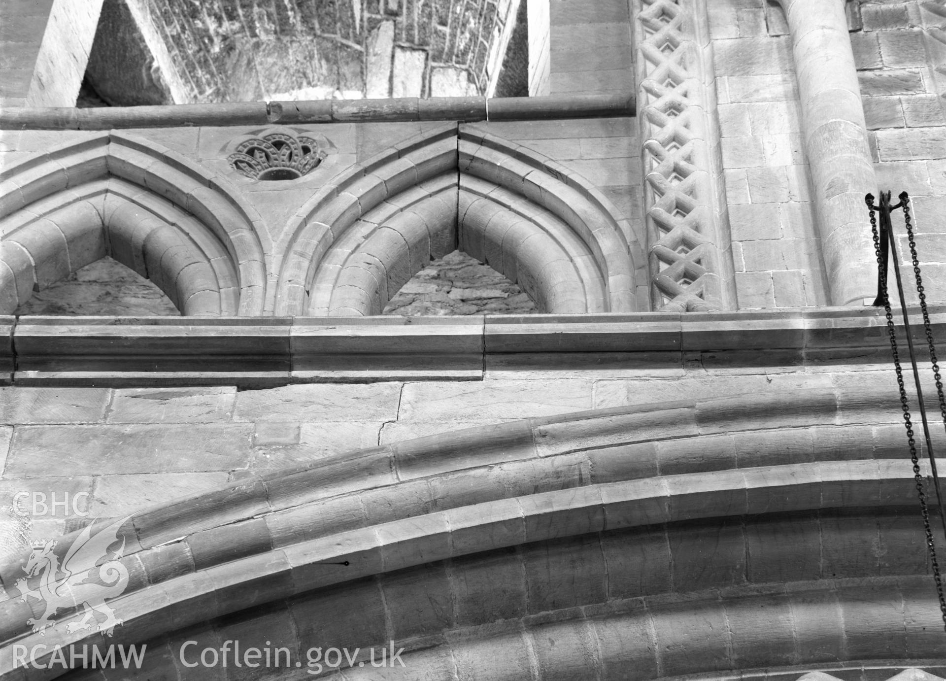 Digital copy of a black and white nitrate negative showing view of arcade above arches at St. David's Cathedral, taken by E.W. Lovegrove, July 1936.