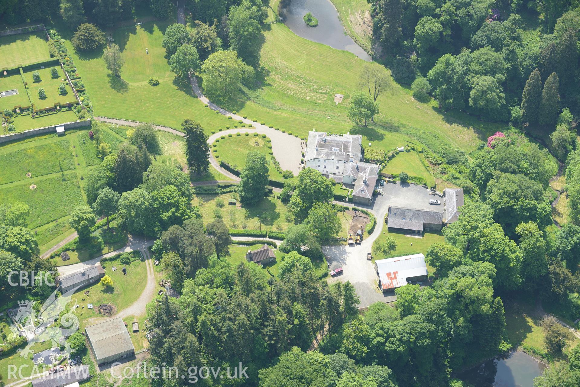 Evancoyd country house, garden and stables, also a mound at Evancoyd. Oblique aerial photograph taken during the Royal Commission's programme of archaeological aerial reconnaissance by Toby Driver on 11th June 2015.