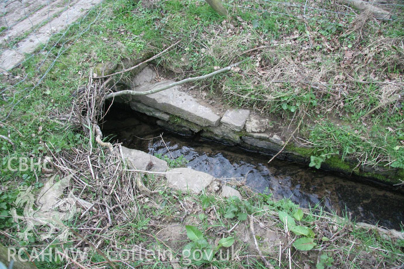 'Stone-lined channel running under western end of bridge (looking south).' Photographed during site visit to land south of school lane, Penperlleni. Part of Archaeological Desk Based Assessment conducted by Iestyn Jones of Archaeology Wales, 2014.