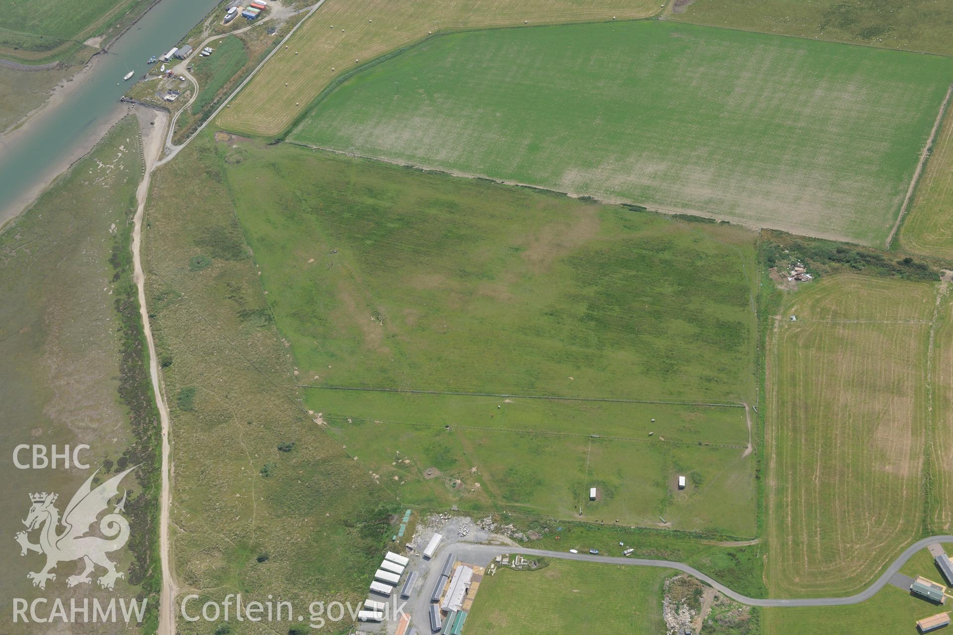 The village of Ynys Las, Ceredigion. Oblique aerial photograph taken during the Royal Commission?s programme of archaeological aerial reconnaissance by Toby Driver on 12th July 2013.