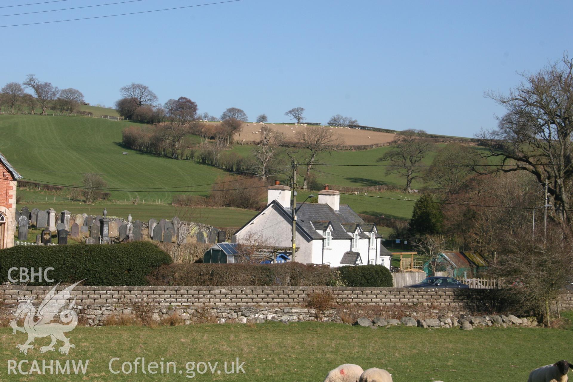 Photograph of housing near Llawrybettws Welsh Calvinistic Methodist chapel, Glanyrafon, Corwen, with associated graveyard on left hand side of photograph. Produced by Tim Allen on 27th February 2019 to meet a condition attached to planning application.