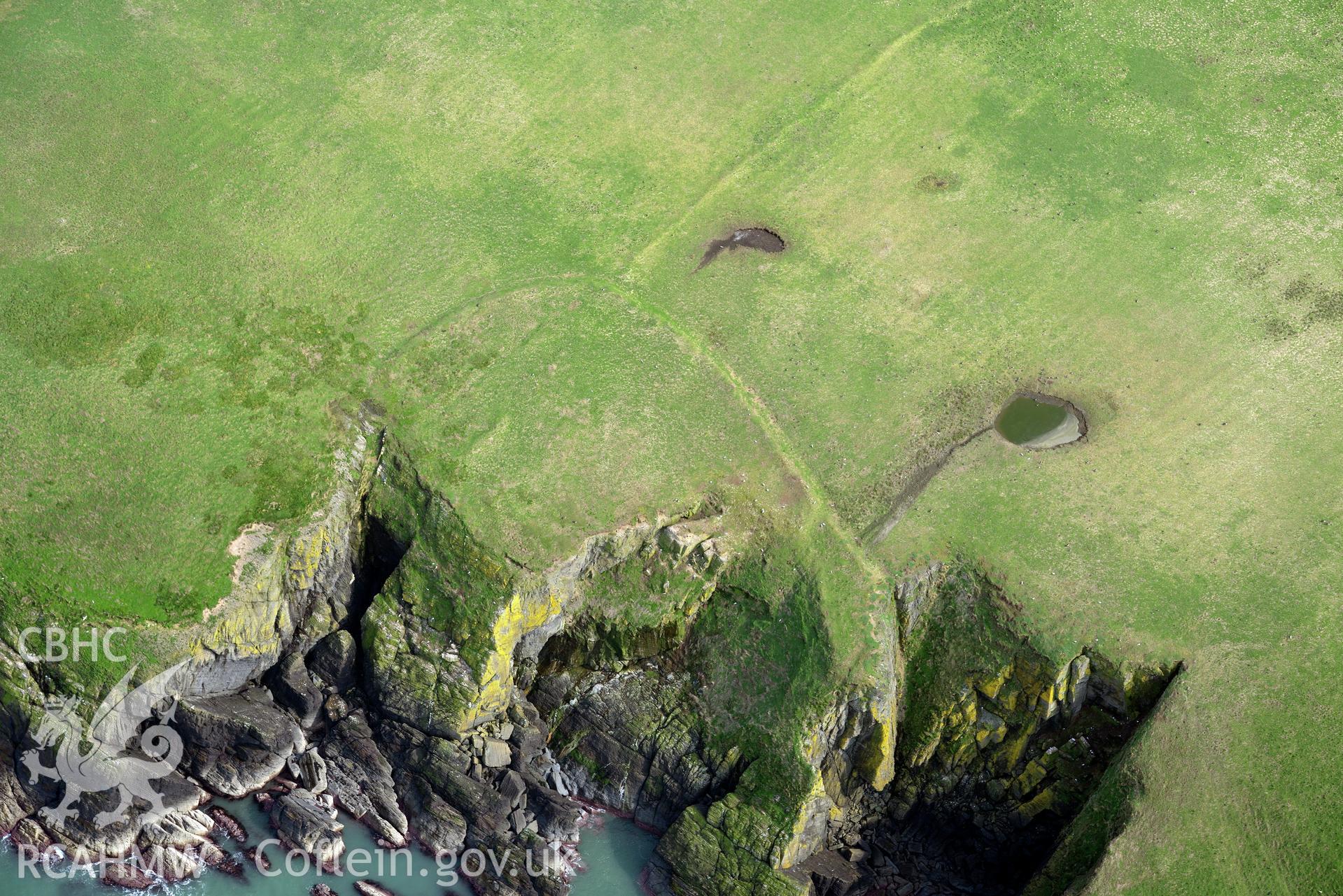 Aerial photography of Cardigan Island promontory enclosure taken on 27th March 2017. Baseline aerial reconnaissance survey for the CHERISH Project. ? Crown: CHERISH PROJECT 2017. Produced with EU funds through the Ireland Wales Co-operation Programme 2014-2020. All material made freely available through the Open Government Licence.