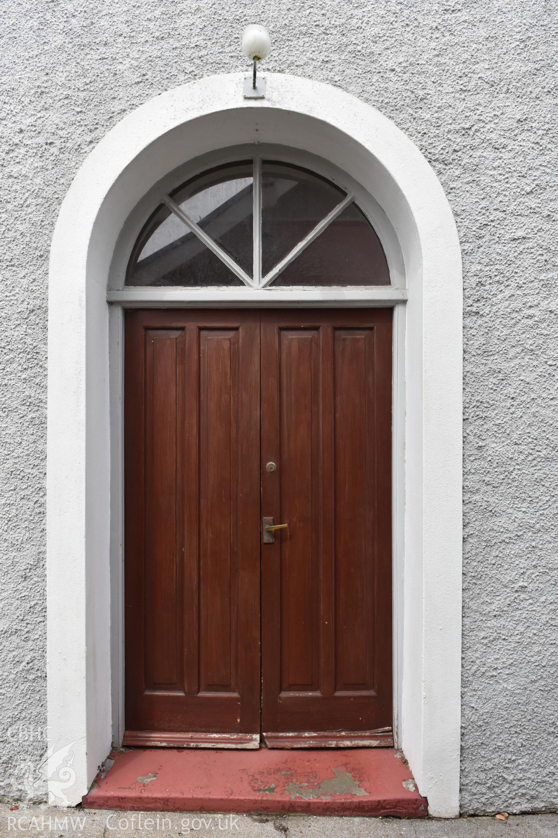 Colour photograph showing exterior view of door to the Baptist & Unitarian Chapel, Nottage, Porthcawl, taken during photographic survey conducted by Sue Fielding on 12th May 2018.