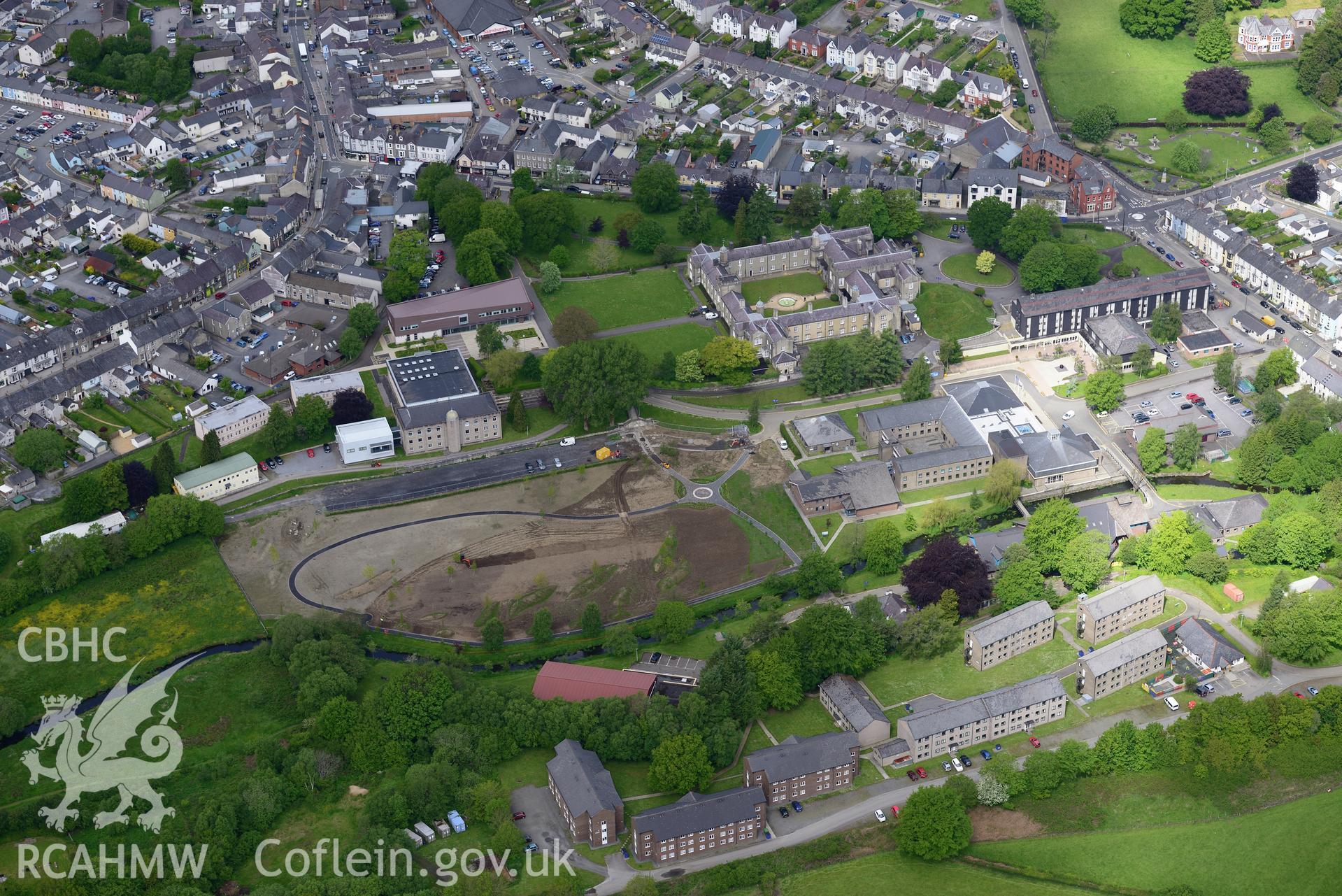 Stephen's castle, St David's college garden and the Roderic Bowen Library and Archives at Lampeter University. Oblique aerial photograph taken during the Royal Commission?s programme of archaeological aerial reconnaissance by Toby Driver on 3rd June 2015.