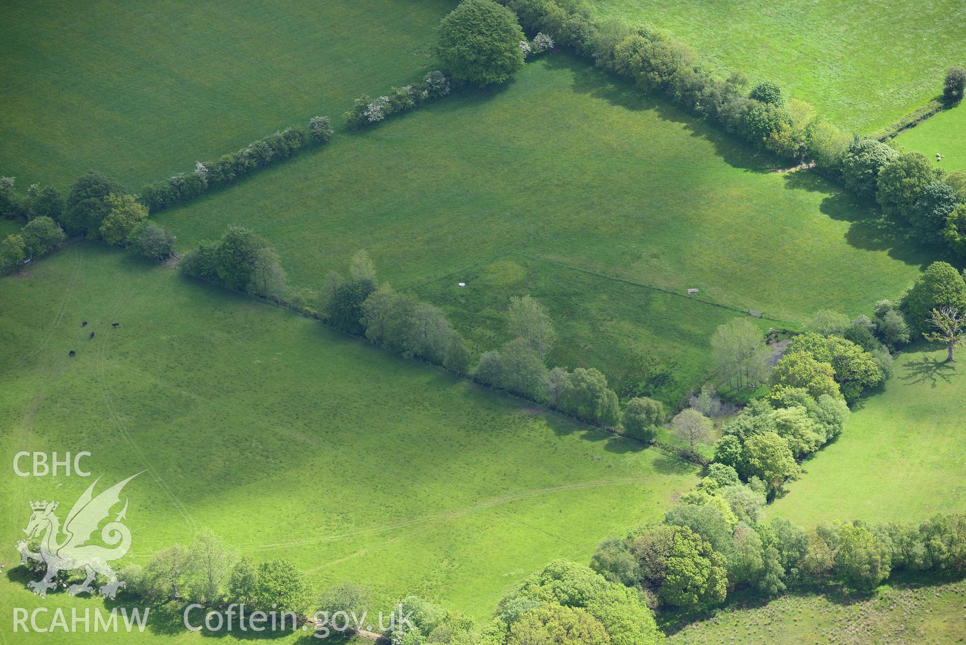 Burnt mound north of Glanrhocca. Oblique aerial photograph taken during the Royal Commission's programme of archaeological aerial reconnaissance by Toby Driver on 3rd June 2015.