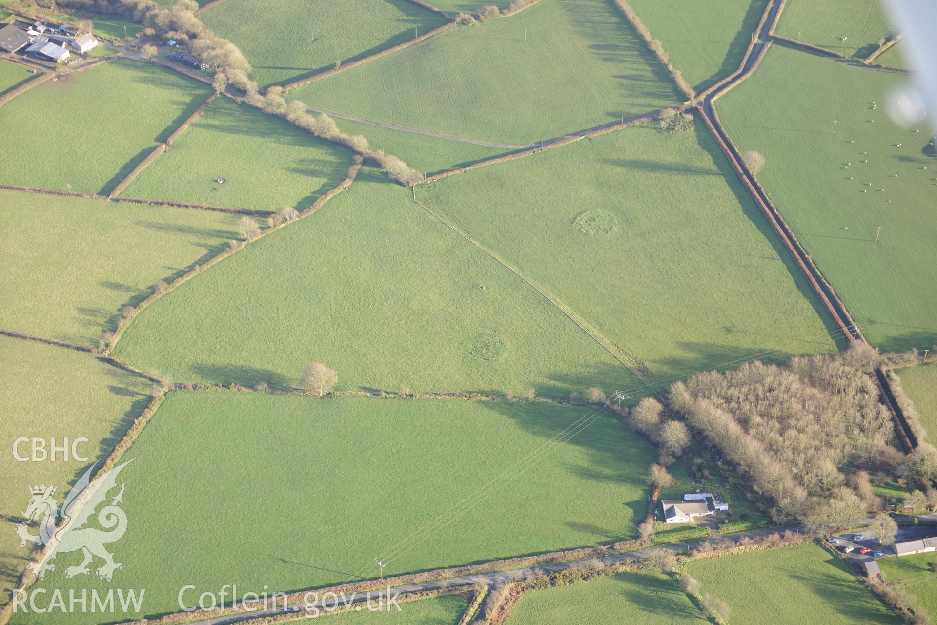 Blaennantrhyd Cairns I - III and the Blaennantrhys Stone. Oblique aerial photograph taken during the Royal Commission's programme of archaeological aerial reconnaissance by Toby Driver on 6th January 2015.