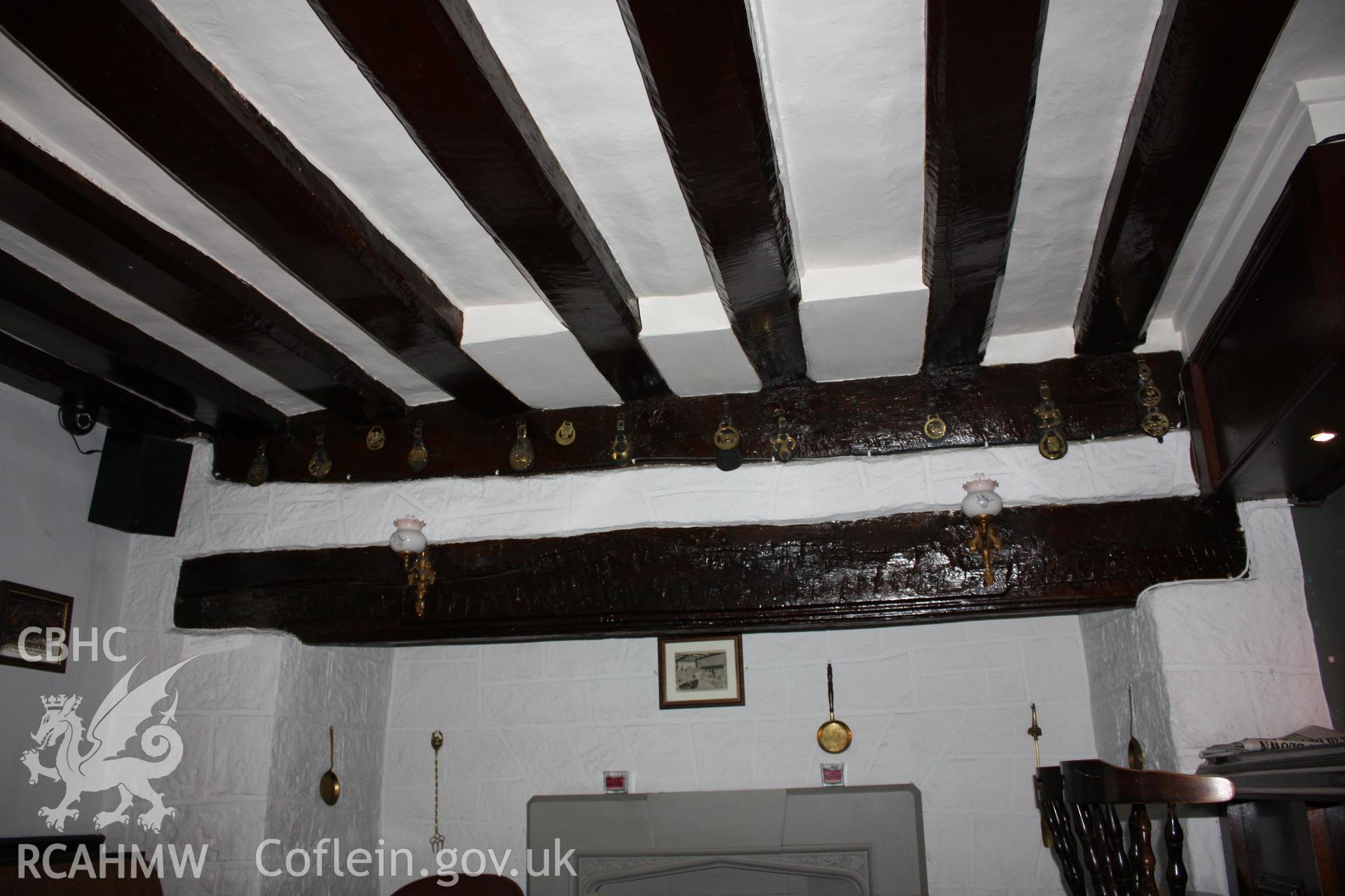 Colour photograph showing wooden ceiling beams and beam above fireplace at the Hope and Anchor at 94 Vale Street, Denbigh, Photographed during survey conducted by Geoff Ward on 7th January 2012.