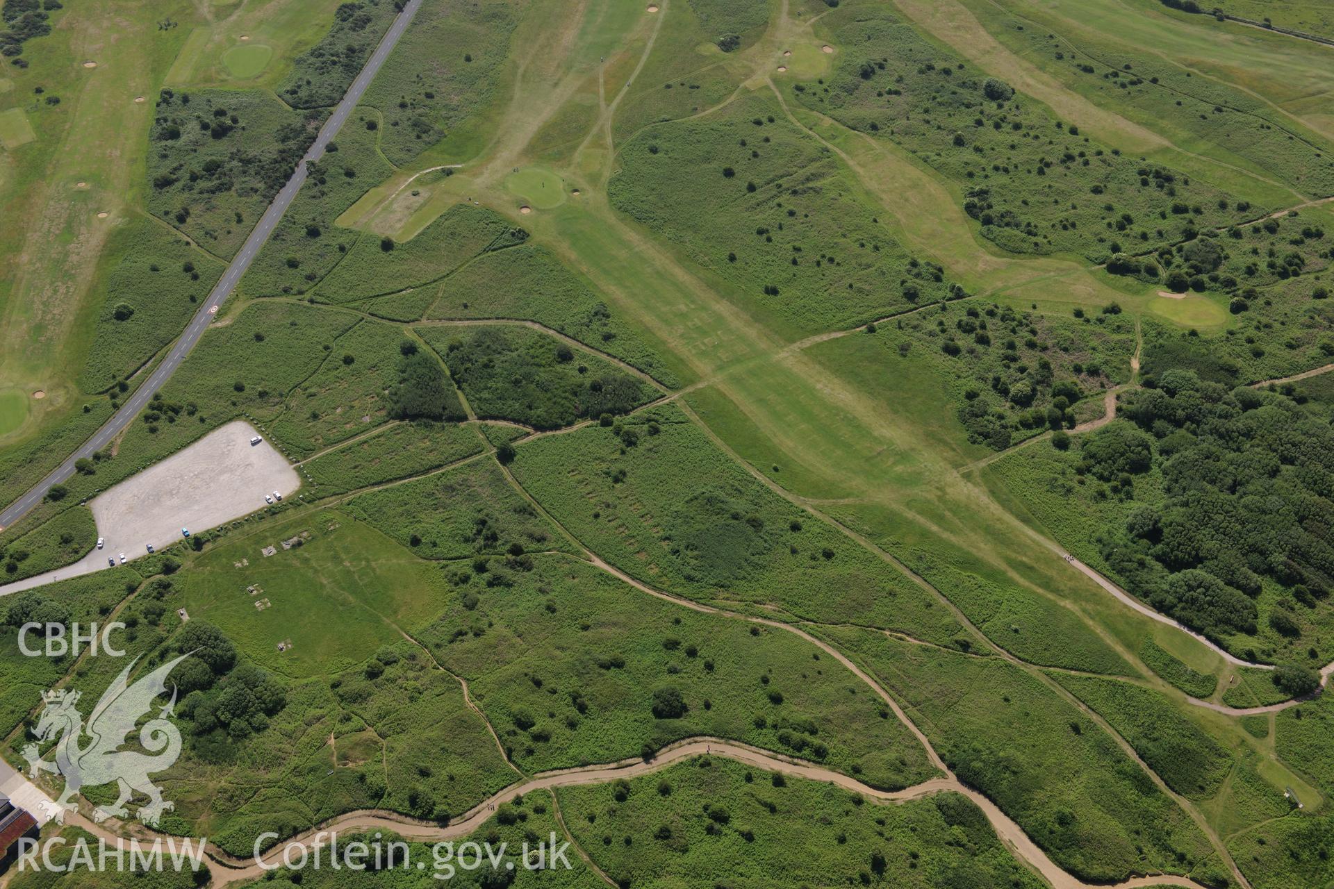 Kenfig Burrows Military Training Area and Pyle and Kenfig Golf Club. Oblique aerial photograph taken during the Royal Commission's programme of archaeological aerial reconnaissance by Toby Driver on 19th June 2015.