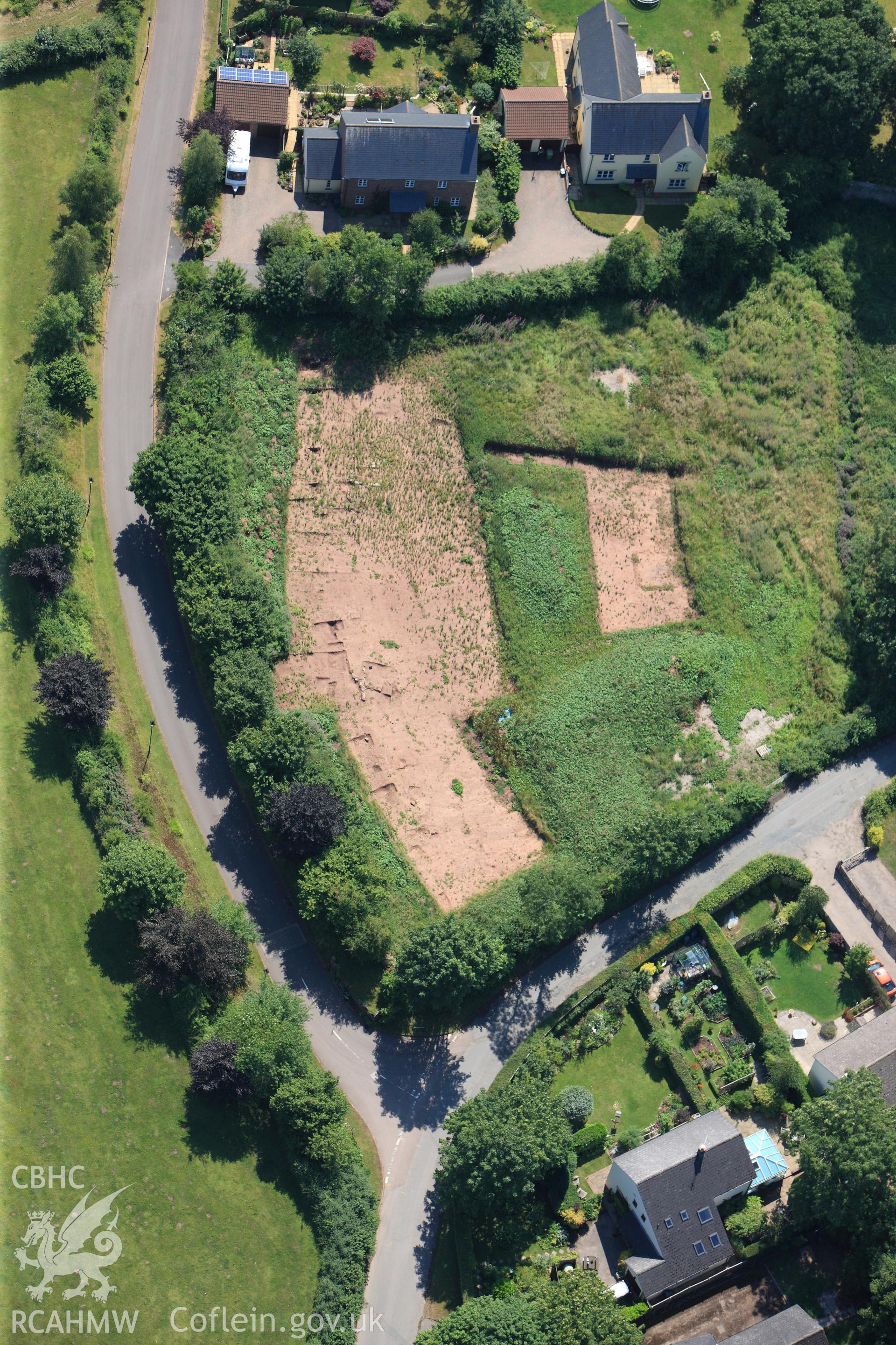 Land opposite the church at Trellech village, south of Monmouth. Oblique aerial photograph taken during the Royal Commission?s programme of archaeological aerial reconnaissance by Toby Driver on 1st August 2013.
