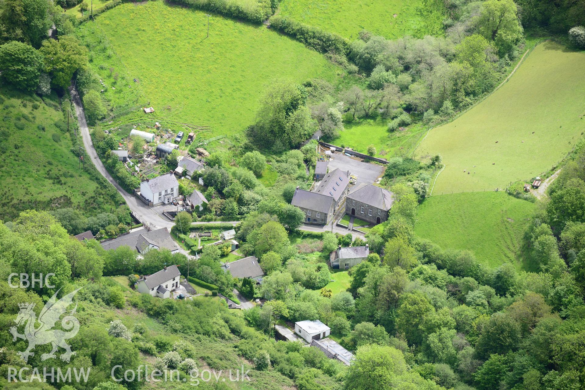 Capel-y-Graig Methodist Chapel and Cwmbach Primary School, Cwmbach, north Carmarthenshire. Oblique aerial photograph taken during the Royal Commission's programme of archaeological aerial reconnaissance by Toby Driver on 3rd June 2015.