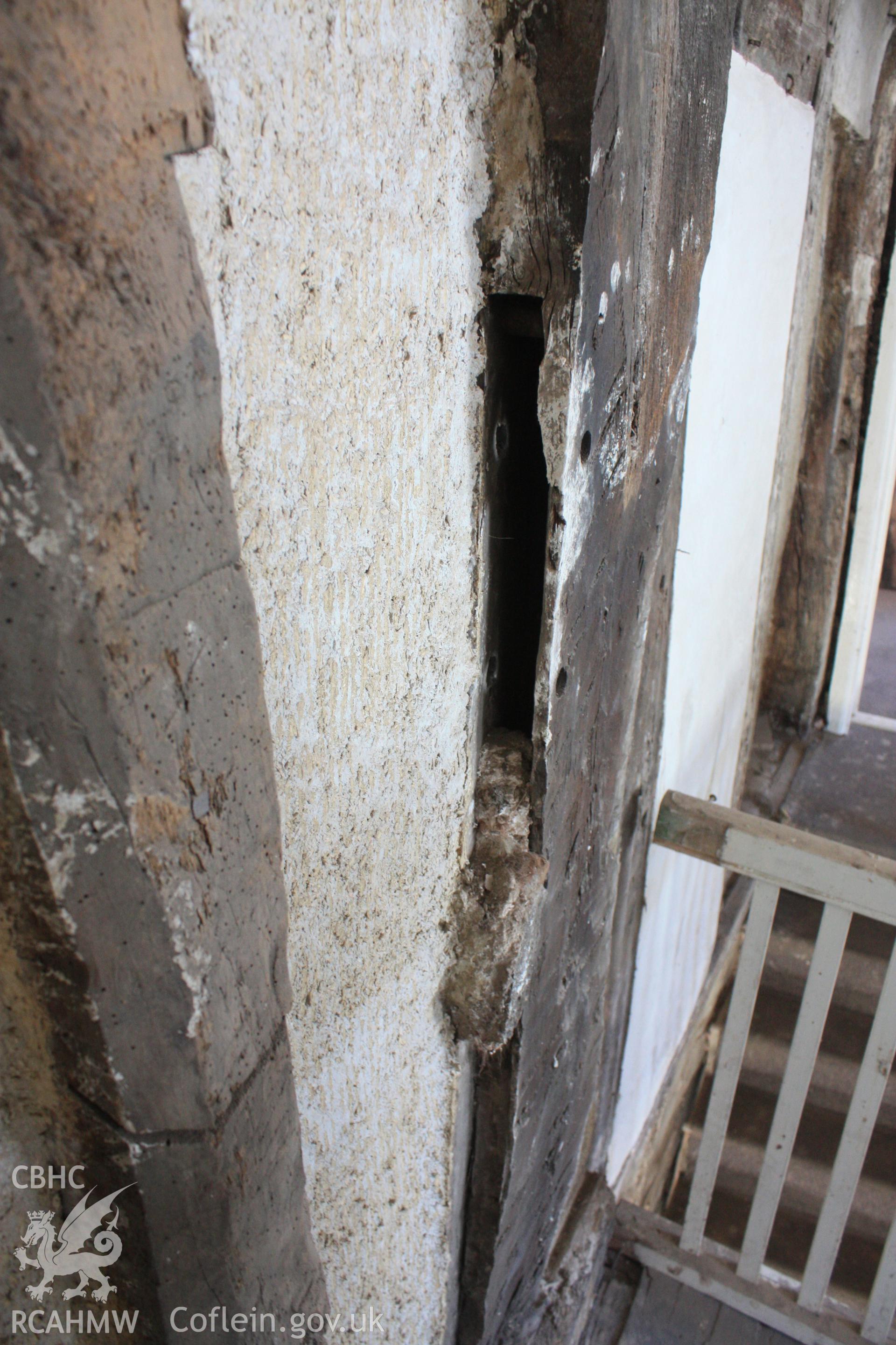 Colour photograph showing detail of mortice, possible for a mid rail or brace at Porth-y-Dwr, 67 Clwyd Street, Ruthin. Photographed during survey conducted by Geoff Ward on 10th June 2013.