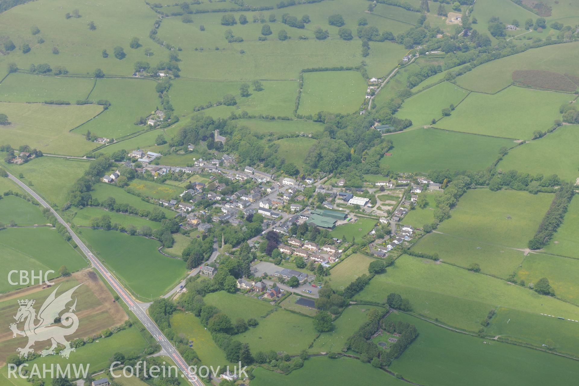 New Radnor, including views of the castle, town defences, interior of medieval town and St. Mary's Church. Oblique aerial photograph taken during the Royal Commission's programme of archaeological aerial reconnaissance by Toby Driver on 11th June 2015.