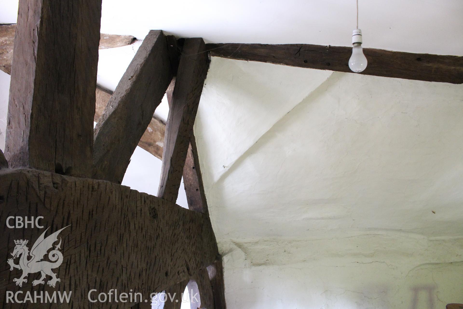 Colour photograph showing detail of timber frame and plastered ceiling at 5-7 Mwrog Street, Ruthin. Photographed during survey conducted by Geoff Ward on 14th May 2014.