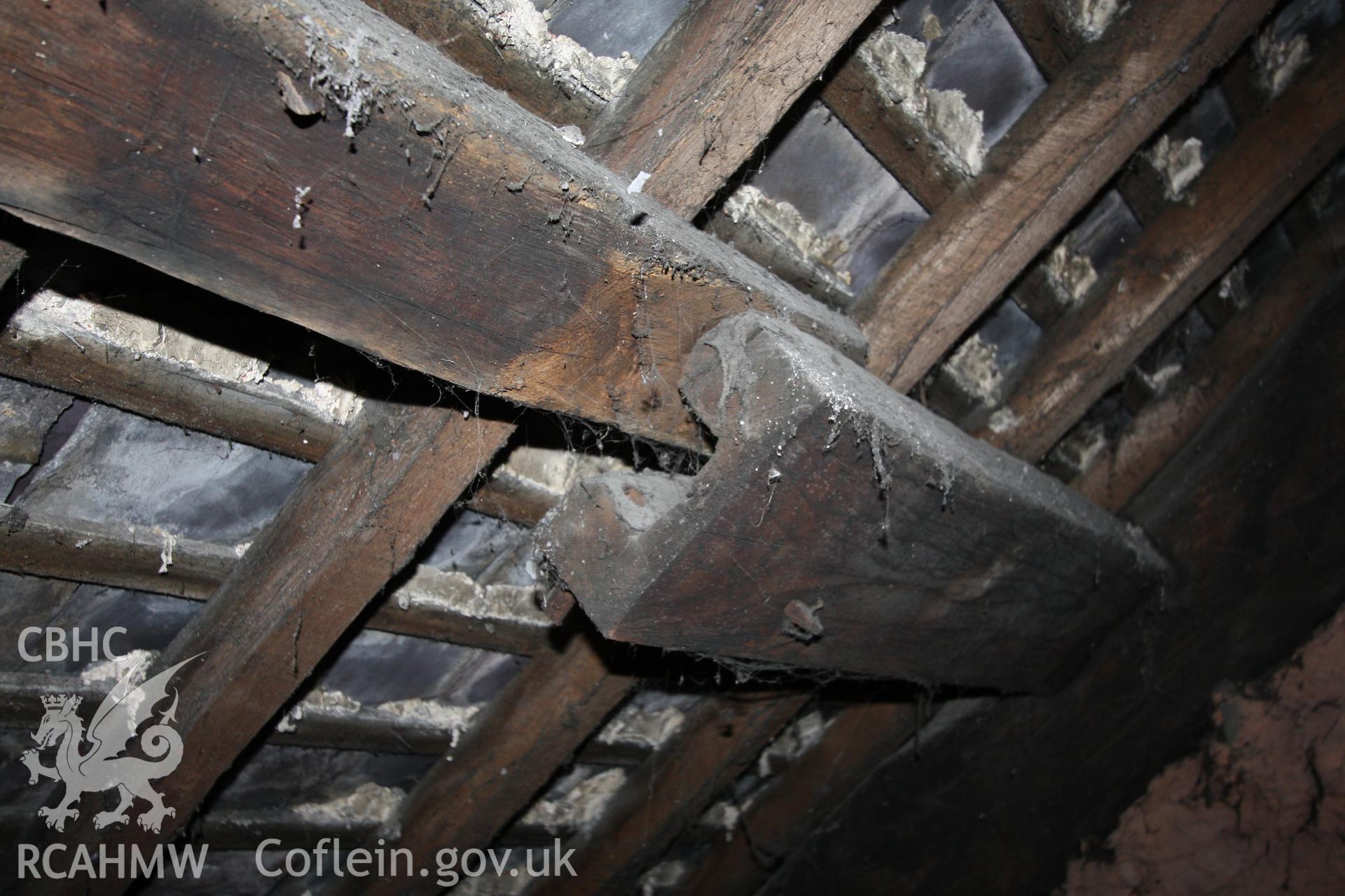 Colour photograph showing detailed interior view of timber roof frame at Porth-y-Dwr, 67 Clwyd Street, Ruthin. Photographed during survey conducted by Geoff Ward on 10th June 2013.