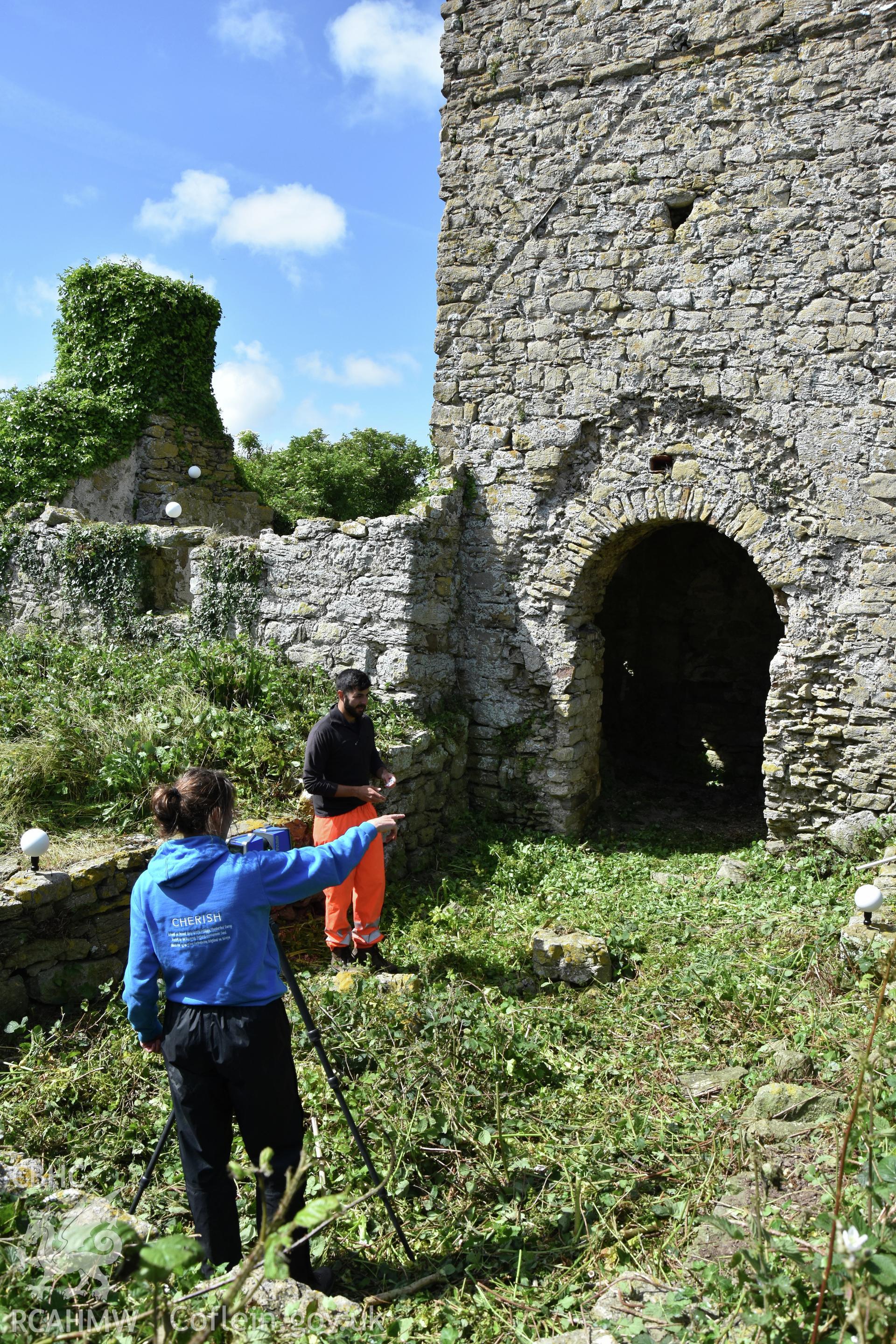 Investigator's photographic survey of the church on Puffin Island or Ynys Seiriol for the CHERISH Project. View showing CHERISH Project staff undertaking survey work. ? Crown: CHERISH PROJECT 2018. Produced with EU funds through the Ireland Wales Co-operation Programme 2014-2020. All material made freely available through the Open Government Licence.