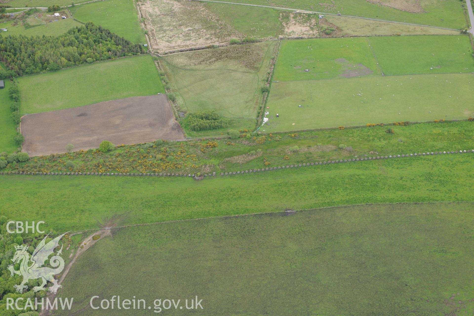 Cube, minefield and stopline, Llangeler. Oblique aerial photograph taken during the Royal Commission's programme of archaeological aerial reconnaissance by Toby Driver on 3rd June 2015.