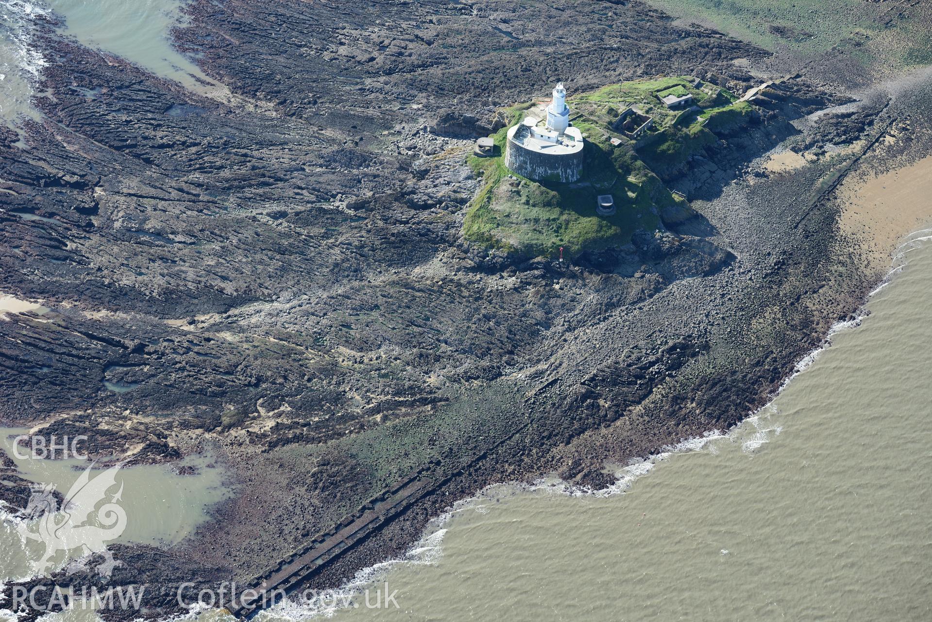Mumbles fort, coast artillery searchlights and Mumbles lighthouse on south western edge of Swansea Bay. Oblique aerial photograph taken during the Royal Commission's programme of archaeological aerial reconnaissance by Toby Driver, 30th September 2015.