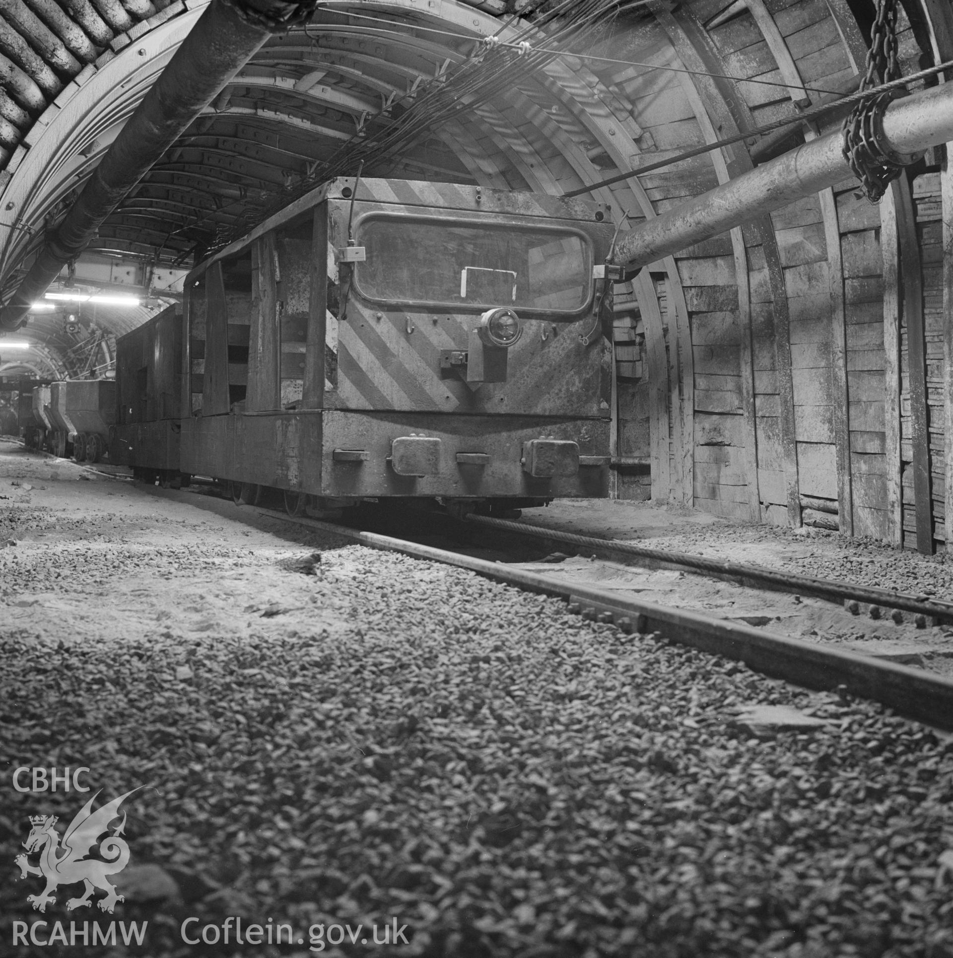 Digital copy of an acetate negative showing rope-hauled underground train at Taff Colliery, from the John Cornwell Collection.