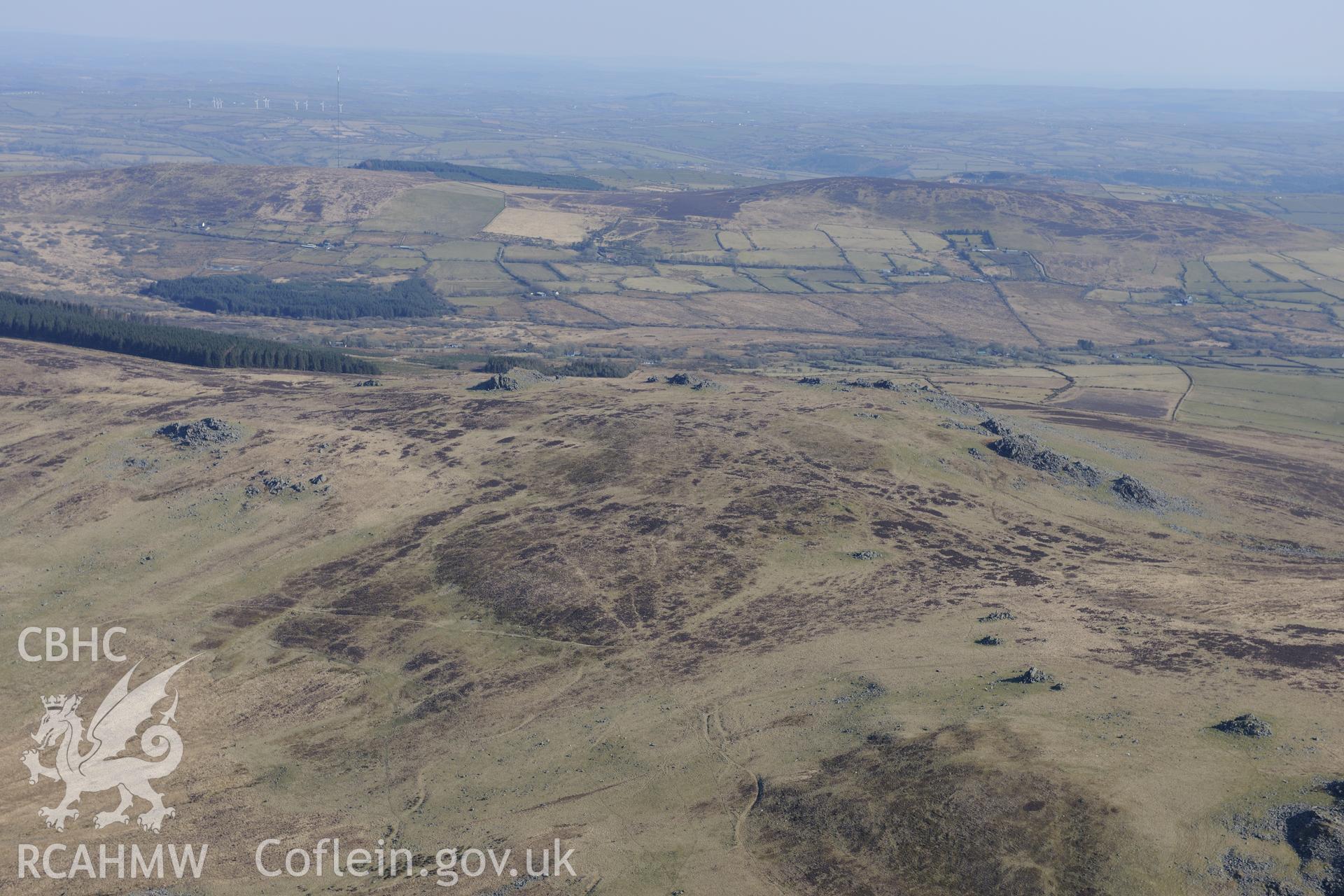 Carn Menyn or Carn Meini 'Bluestone' outcrops of spotted dolerite in the Preseli mountains, west of Crymych. Oblique aerial photograph taken during the Royal Commission's programme of archaeological aerial reconnaissance by Toby Driver on 2nd April 2013.