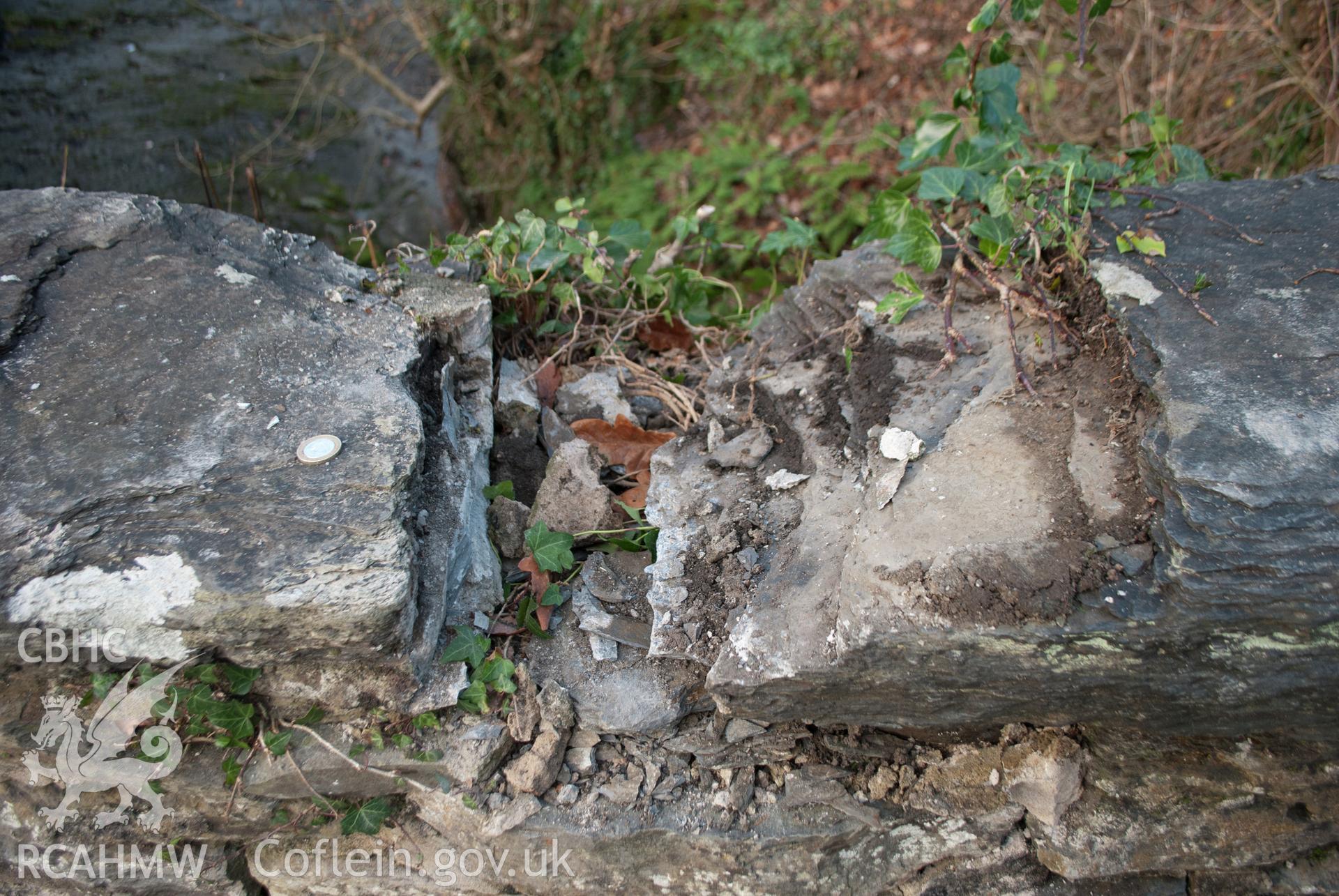 Area of damaged coping at the northwest end of the parapet. View from the north east. Digital photograph taken for Archaeological Watching Brief at Pont y Pair, Betws y Coed, 2019. Gwynedd Archaeological Trust Project no. G2587.