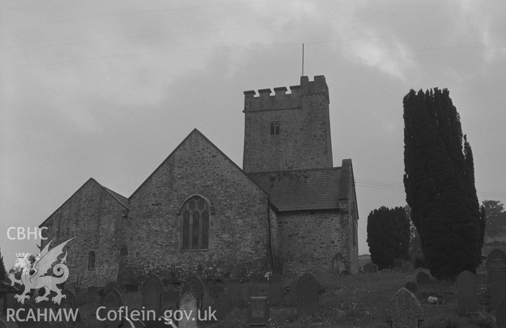 Digital copy of a black and white negative showing the east end of St. Gwenog's Church, Llanwenog. Photographed by Arthur O. Chater in August 1966 looking west from the bottom of the graveyard at Grid Reference SN 494 456.