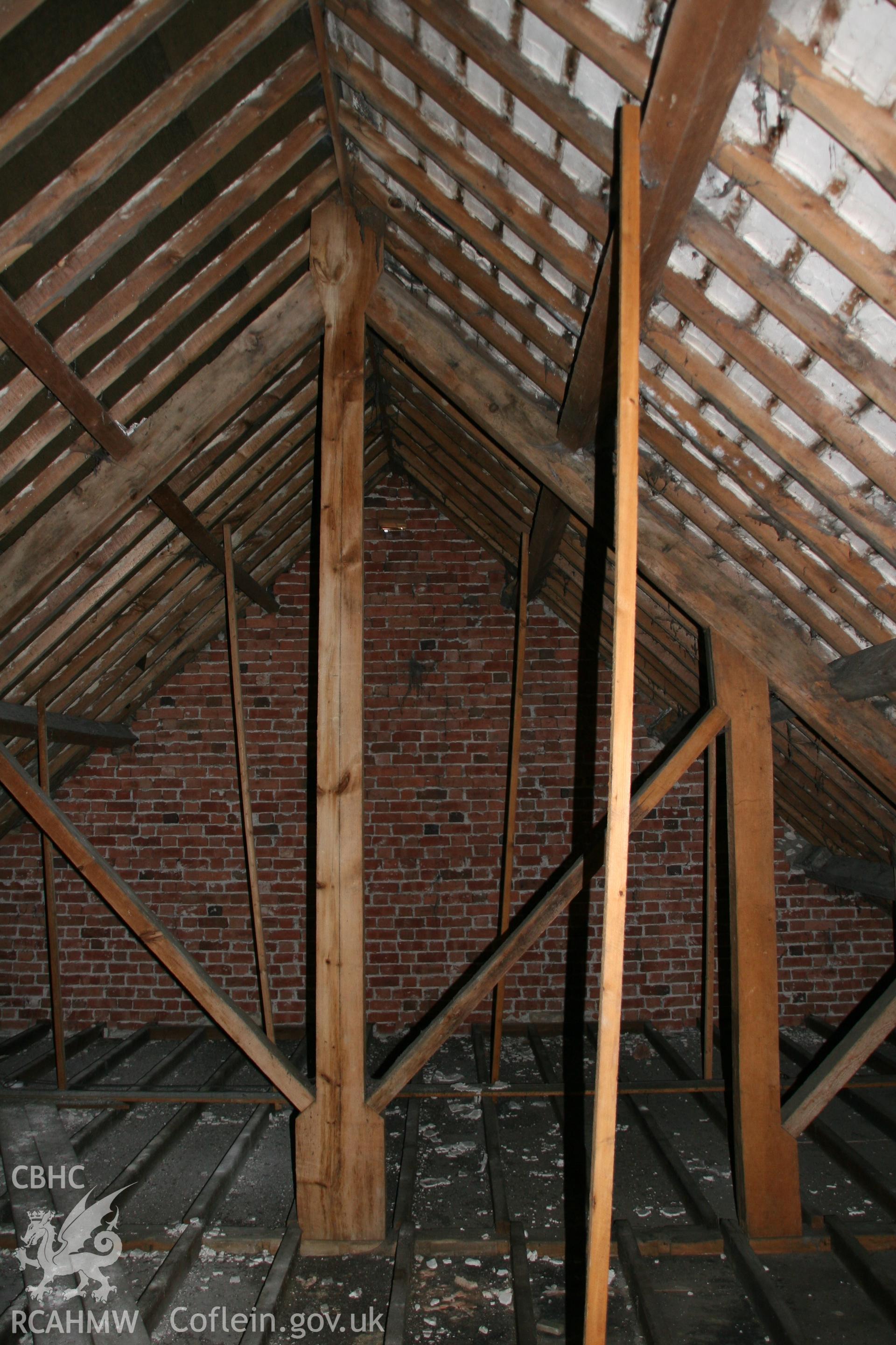 Photograph showing detailed interior view of brick wall & wooden beams in loft of former Llawrybettws Welsh Calvinistic Methodist chapel, Glanyrafon, Corwen. Taken by Tim Allen on 27th February 2019 to meet a condition attached to planning application.